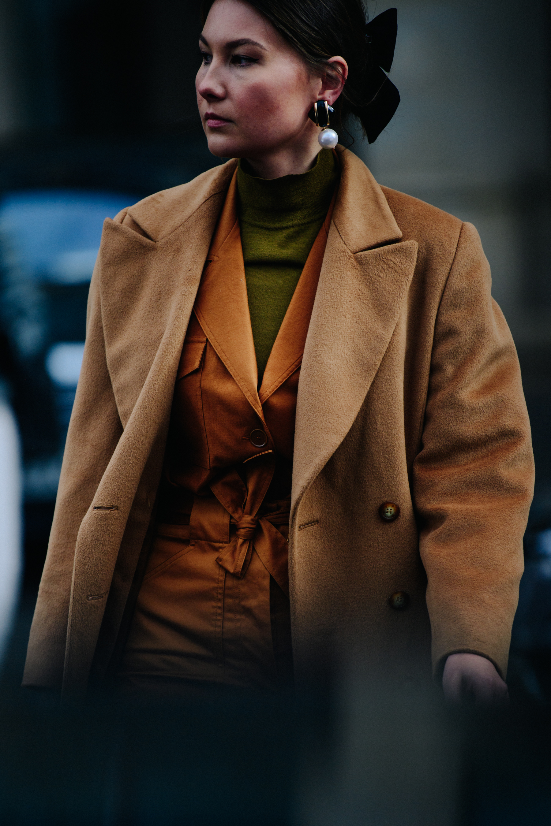 Woman wearing tan coat