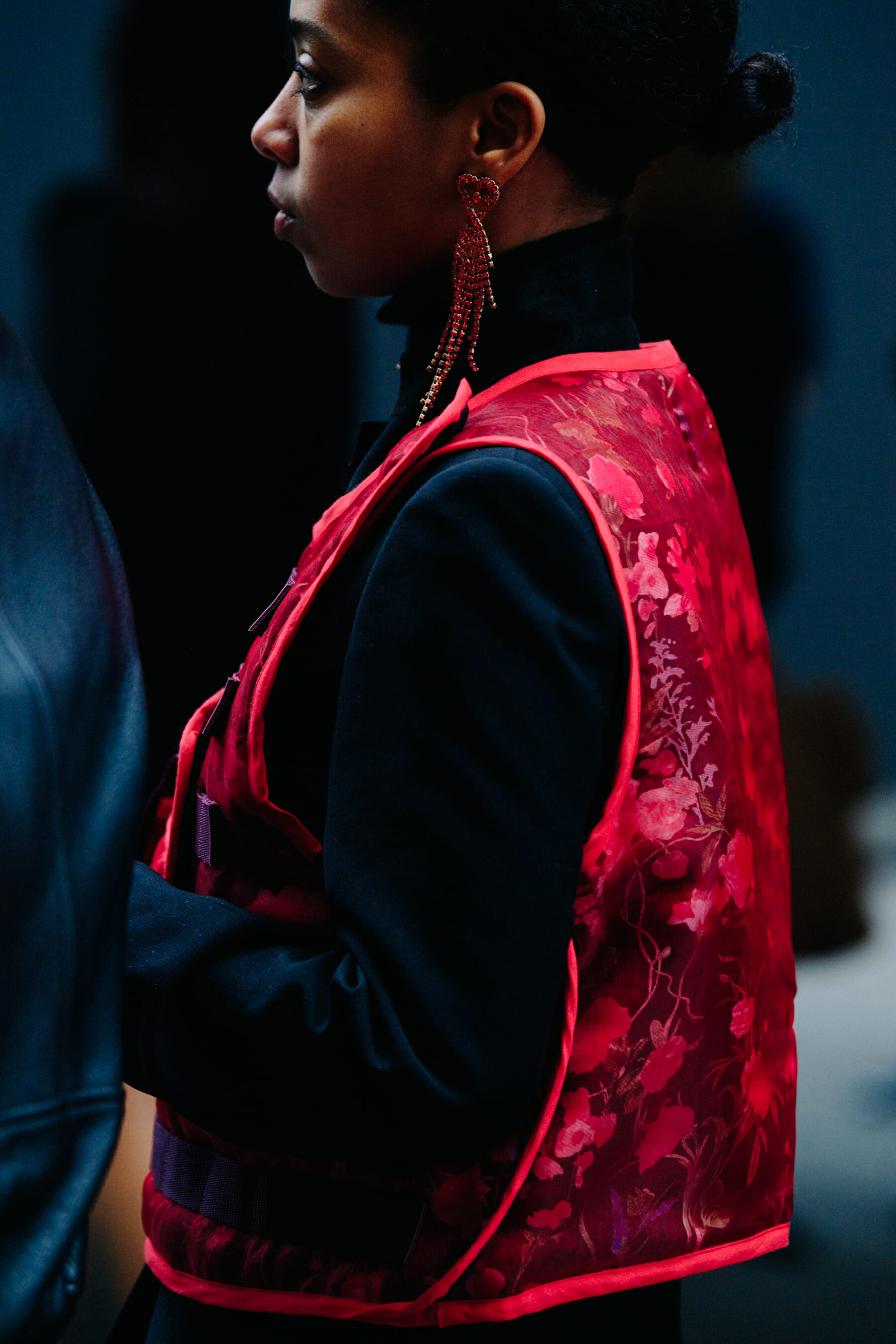 Woman wearing red vest