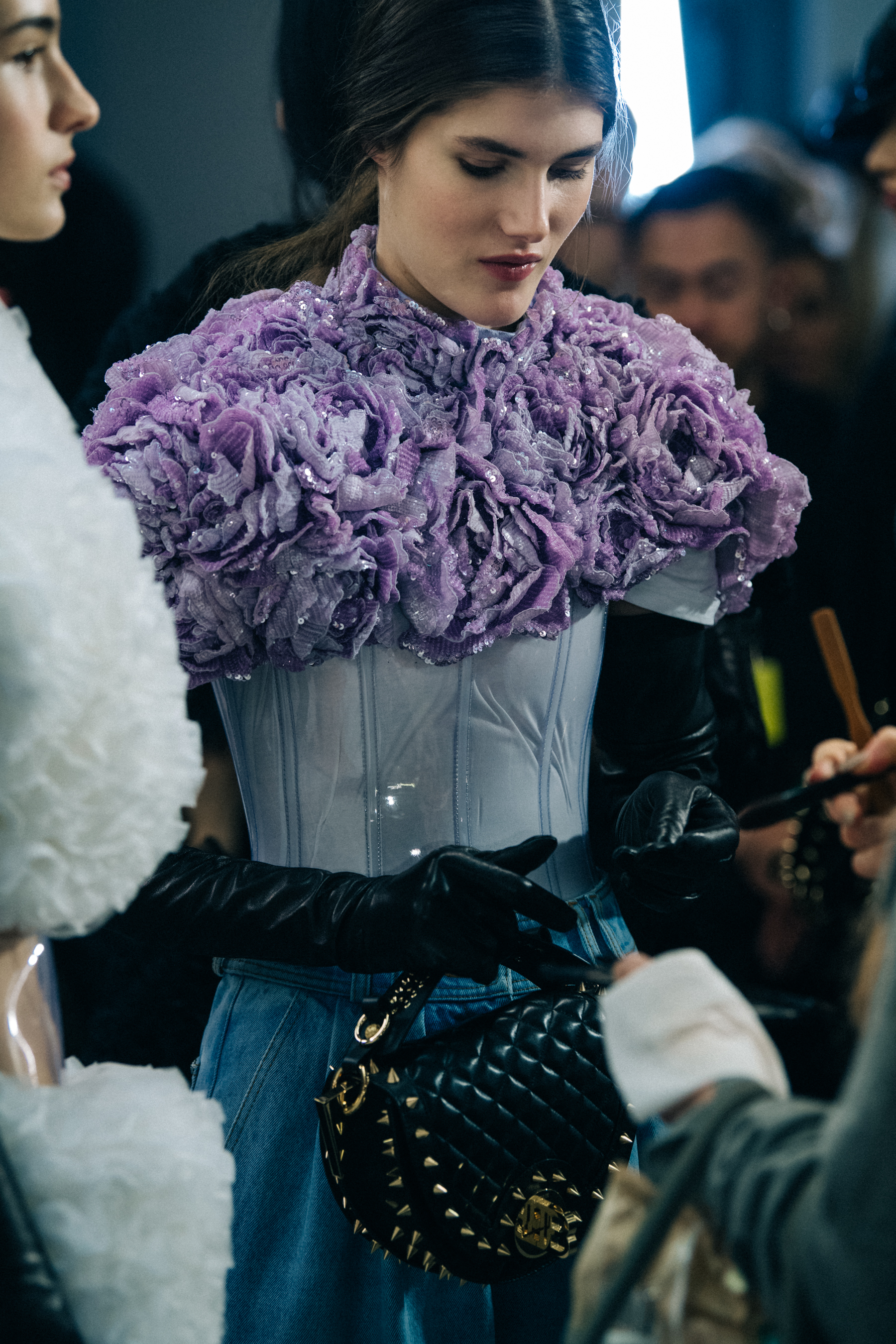 Models wearing studs backstage at Balmain