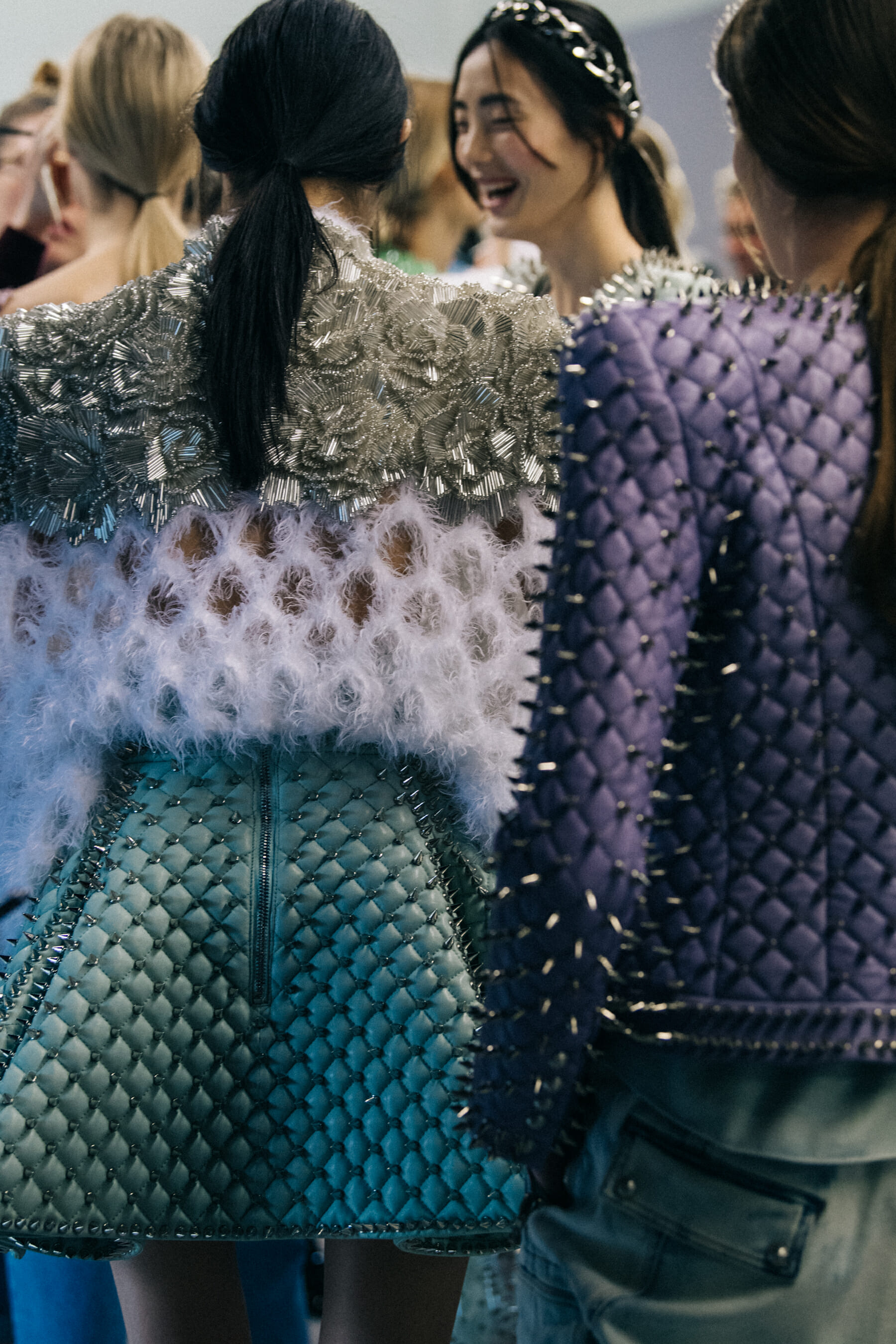 Models wearing studs backstage at Balmain