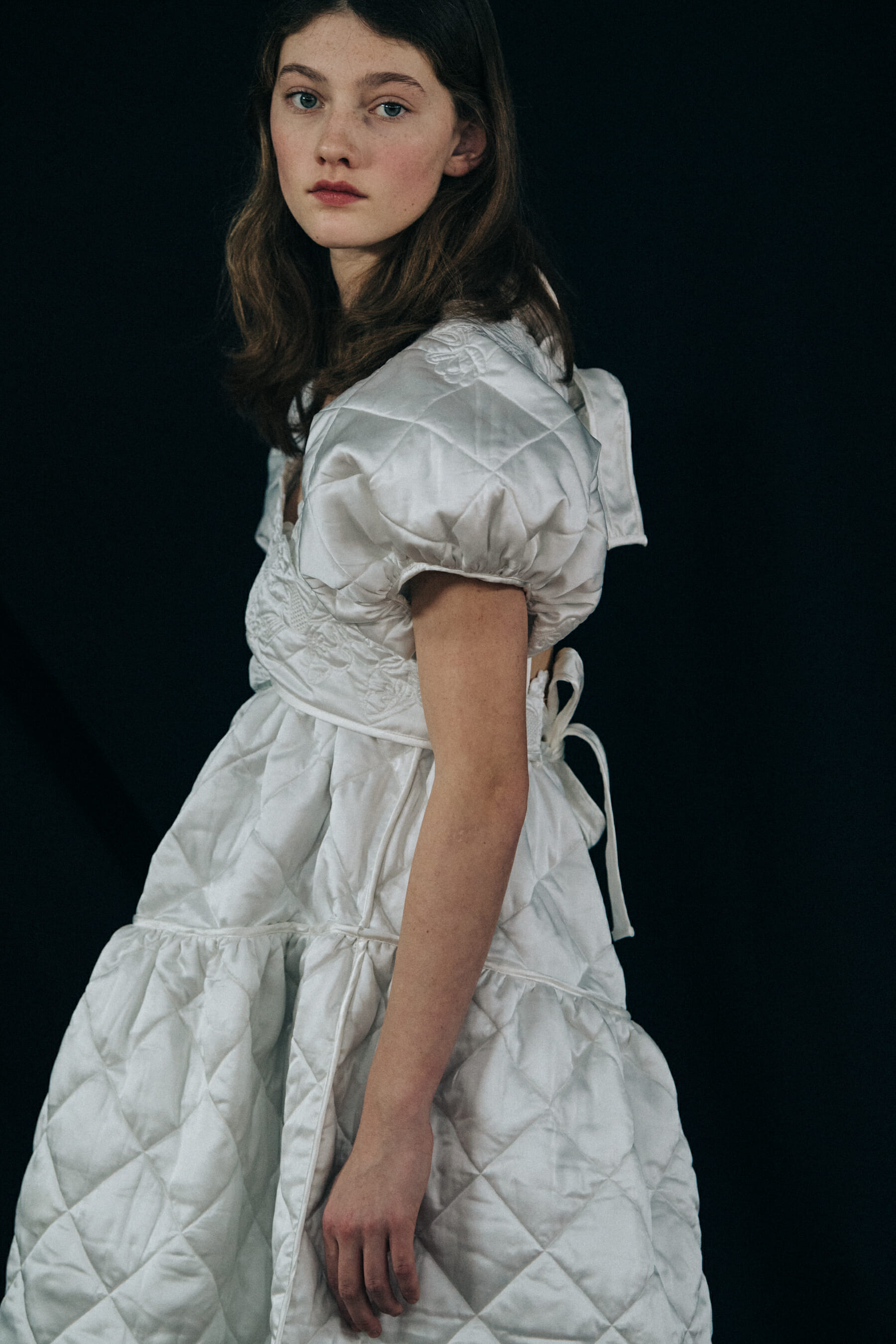 Model wearing white dress at Cecilie Bahnsen