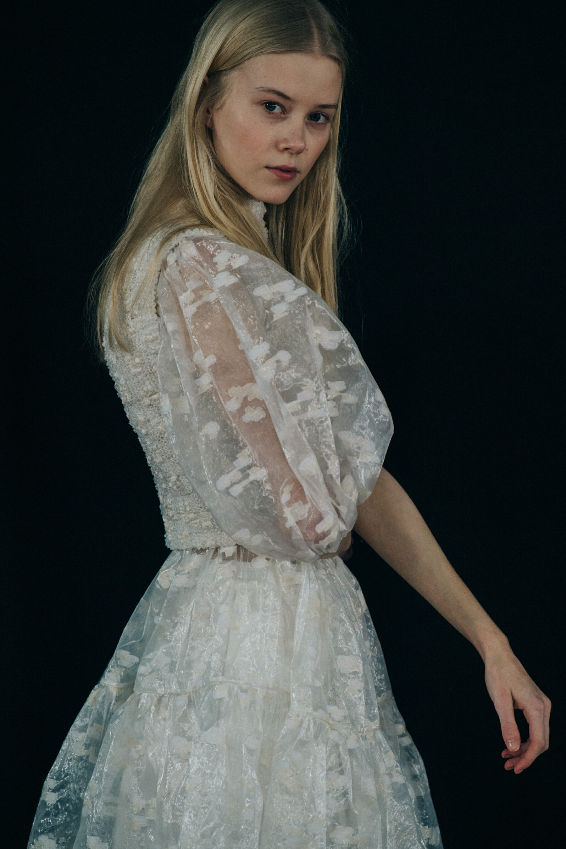 Model wearing white dress at Cecilie Bahnsen