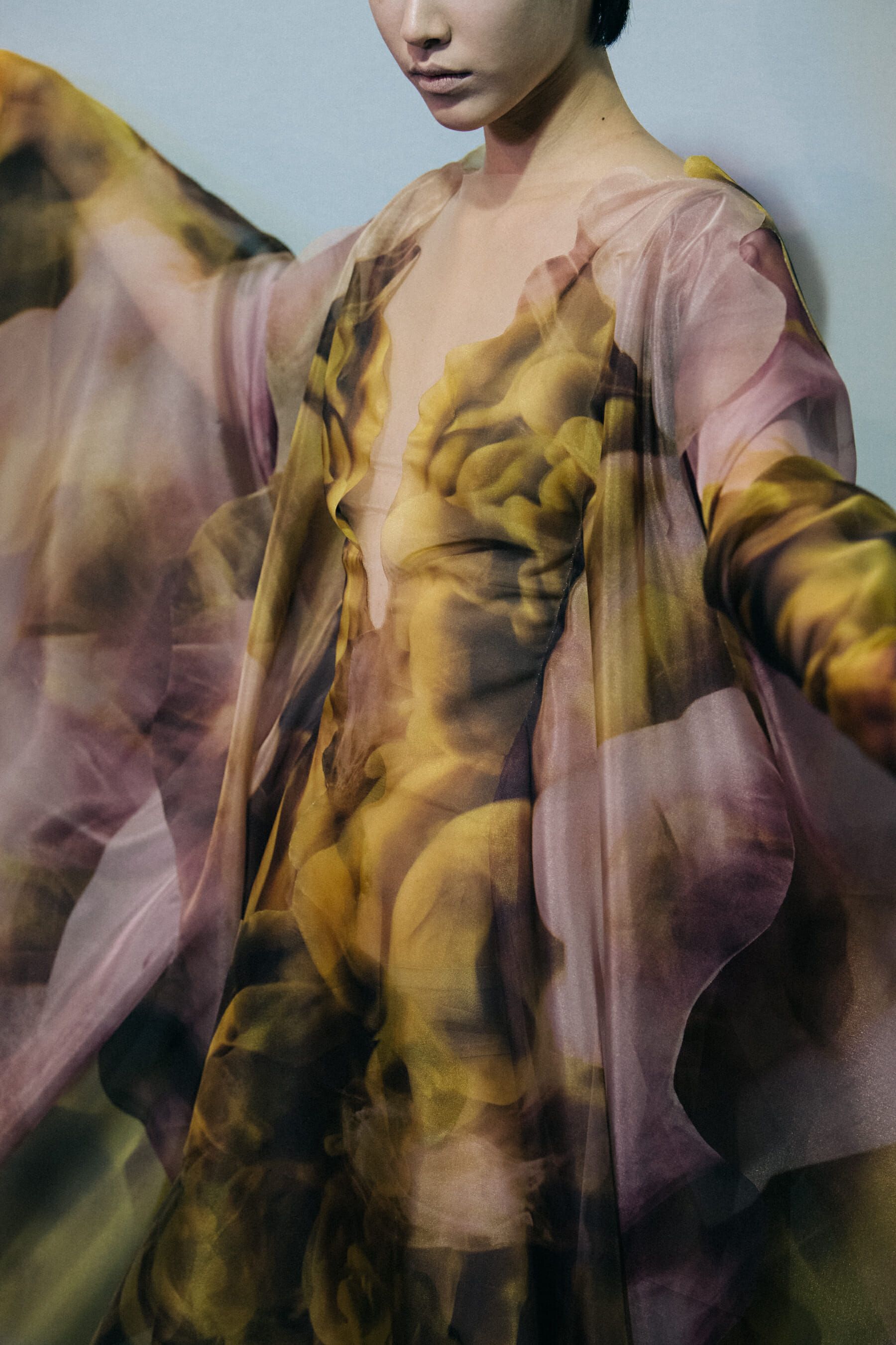 Model wearing yellow and pink dress at Iris van Herpen