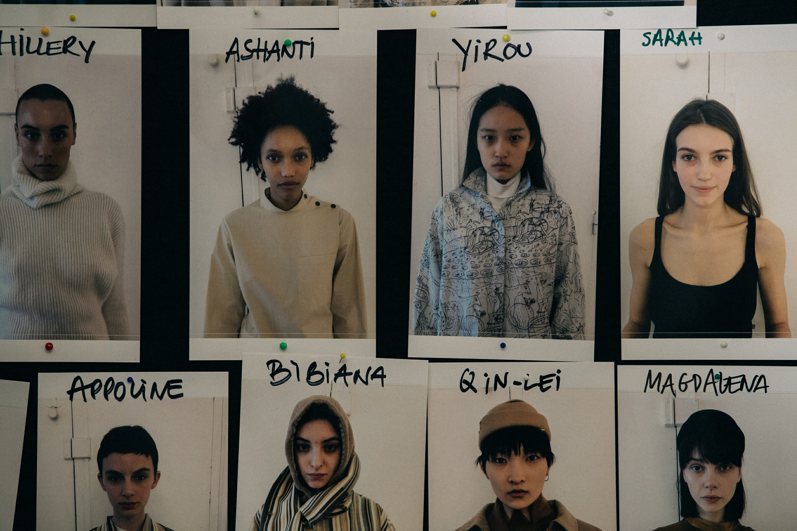 Model cards backstage at Nehera