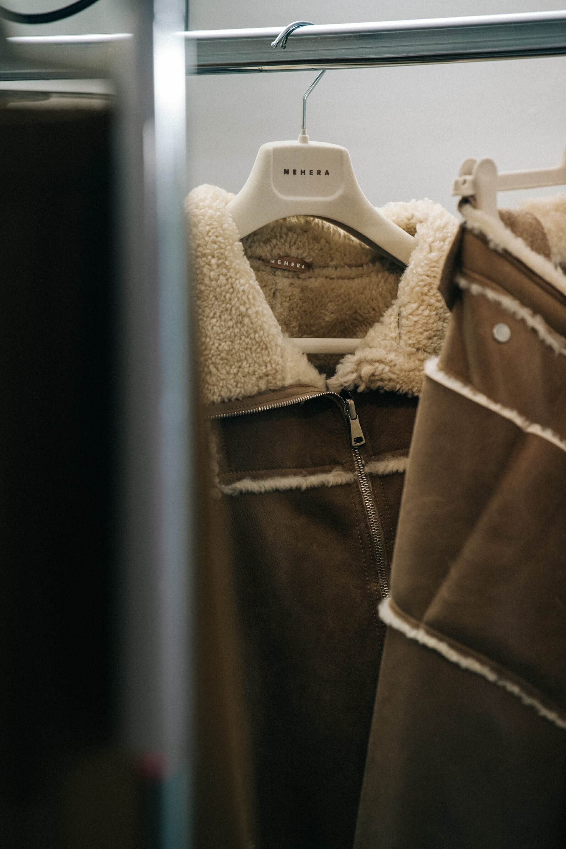 Clothes hanging backstage at Nehera