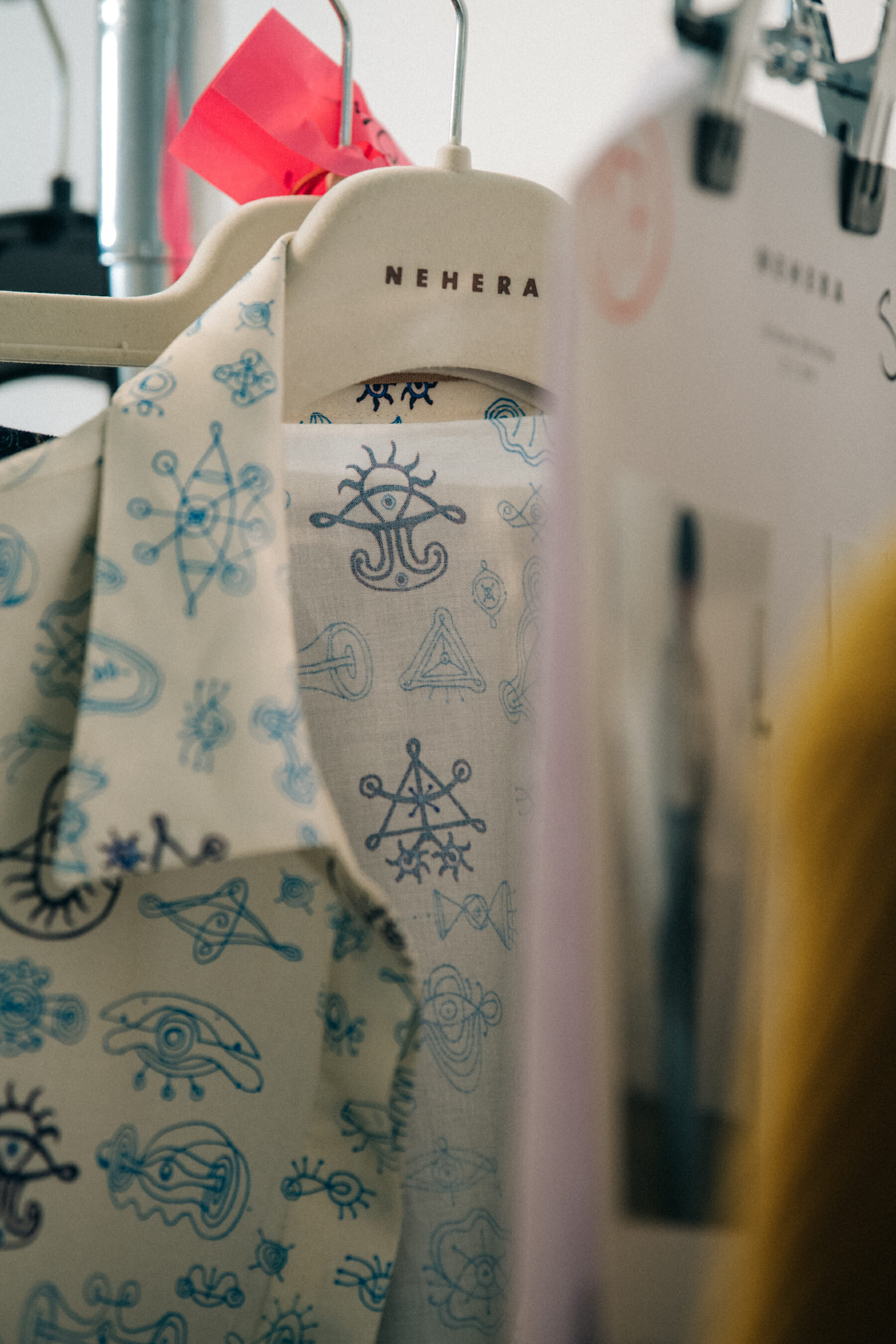 Clothes hanging backstage at Nehera