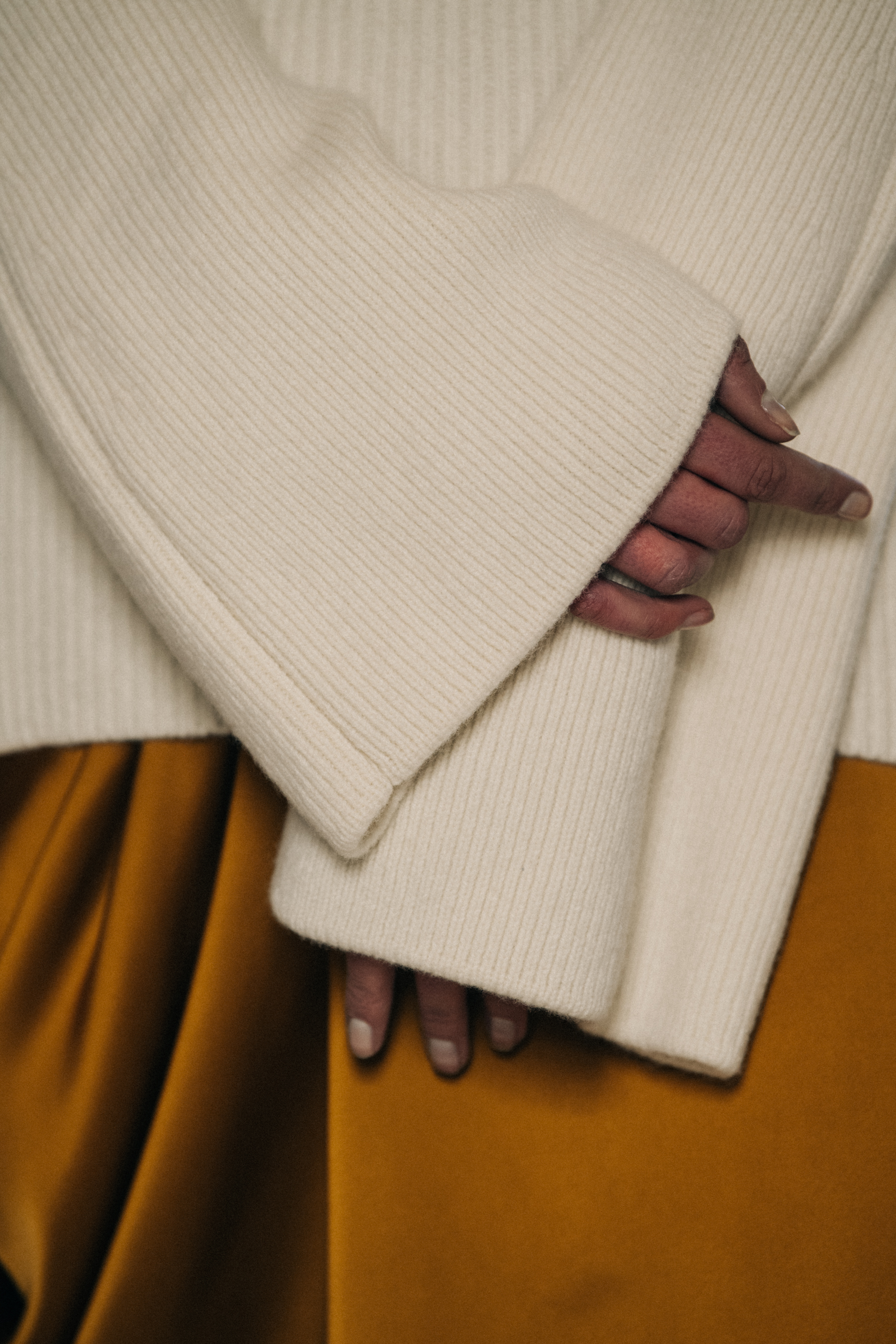 Model wearing gold backstage at Nehera