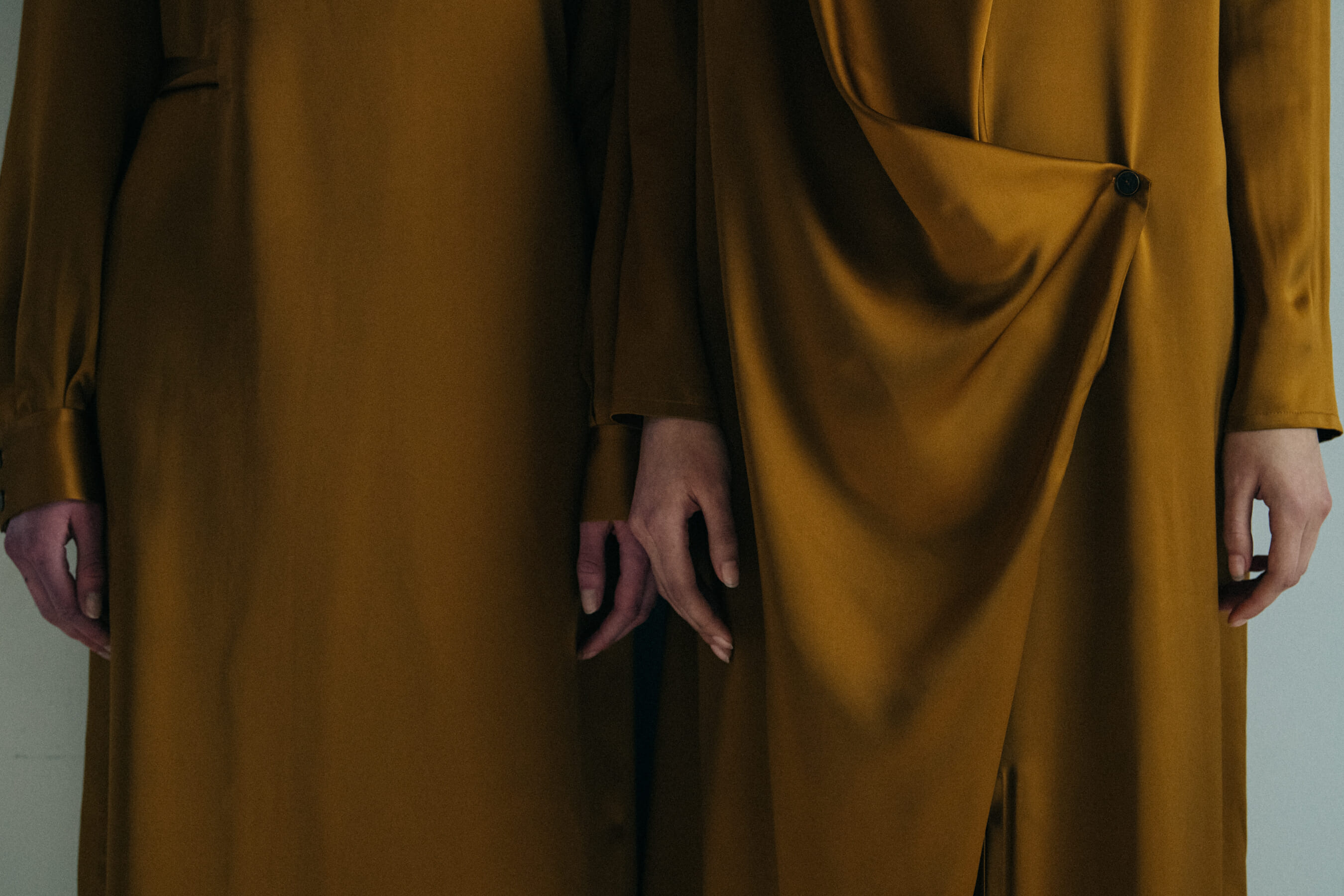 Model wearing gold backstage at Nehera