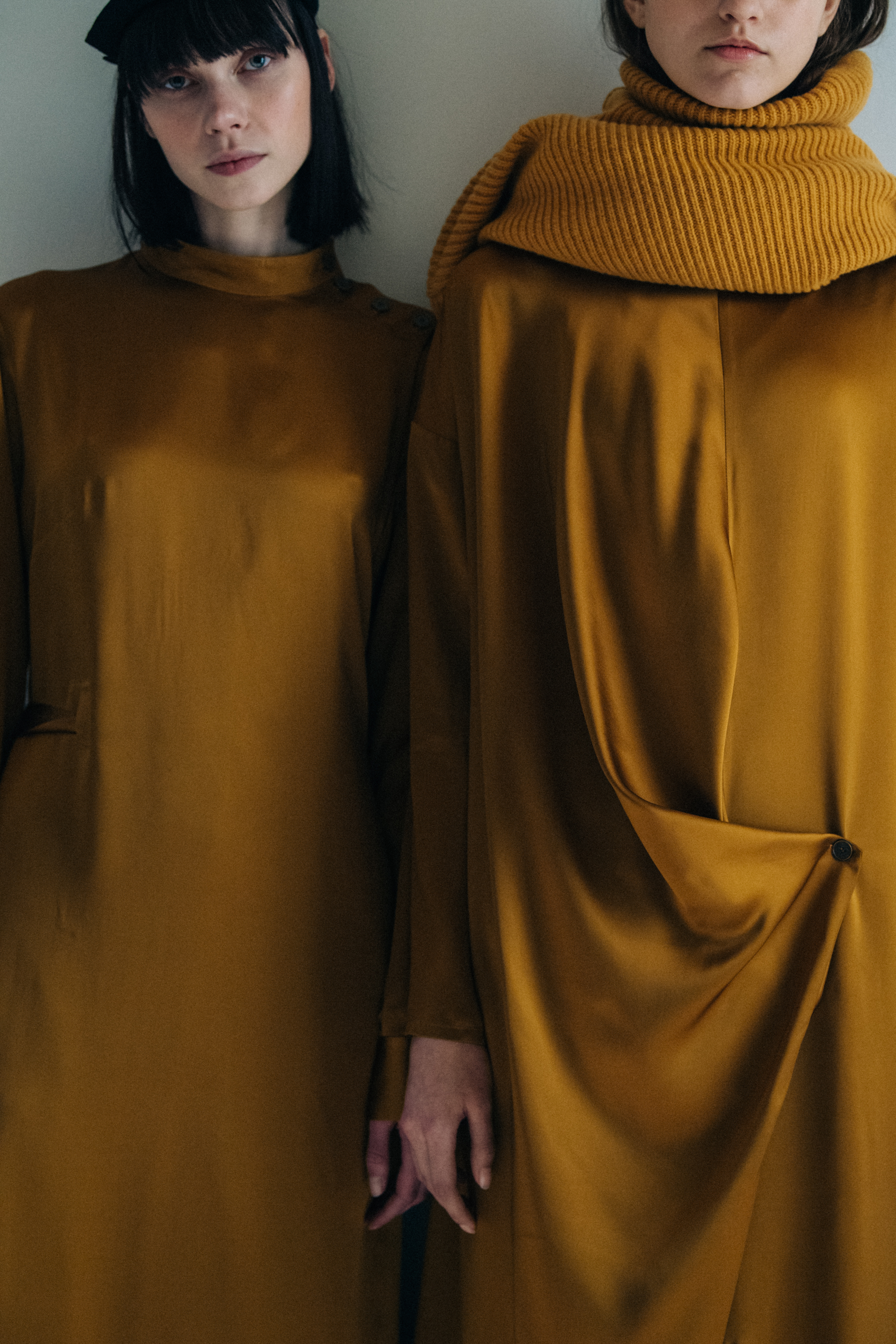 Model wearing gold backstage at Nehera