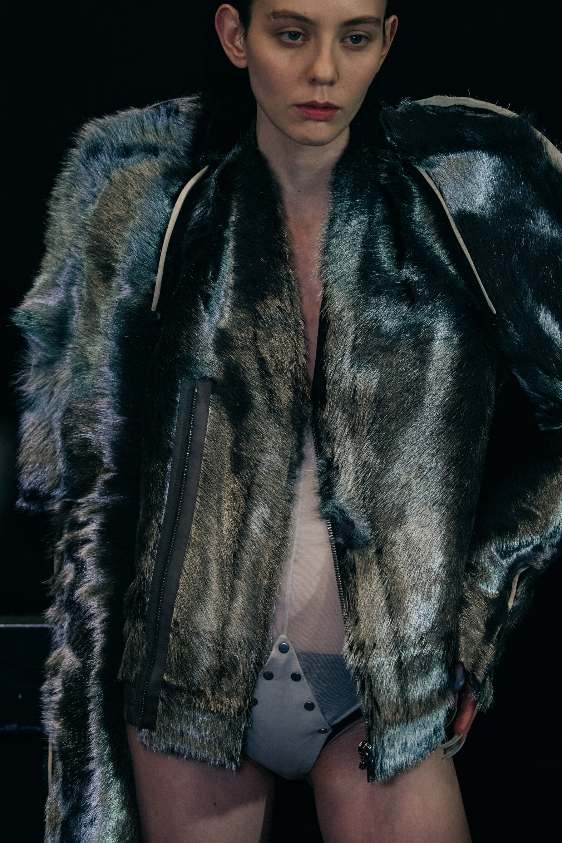 Model wearing fur backstage at Rick Owens