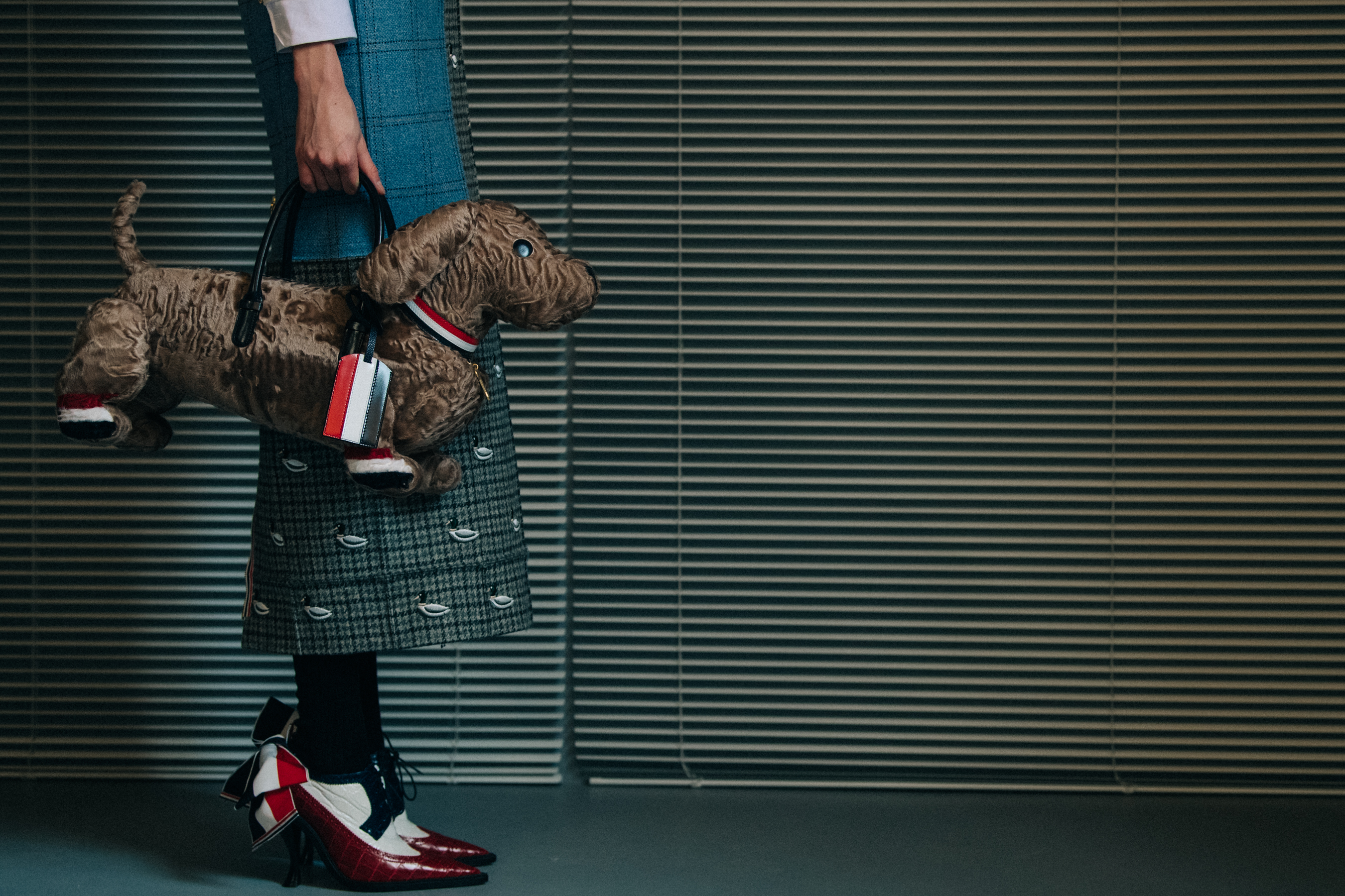 Models carrying Thom Browne bags