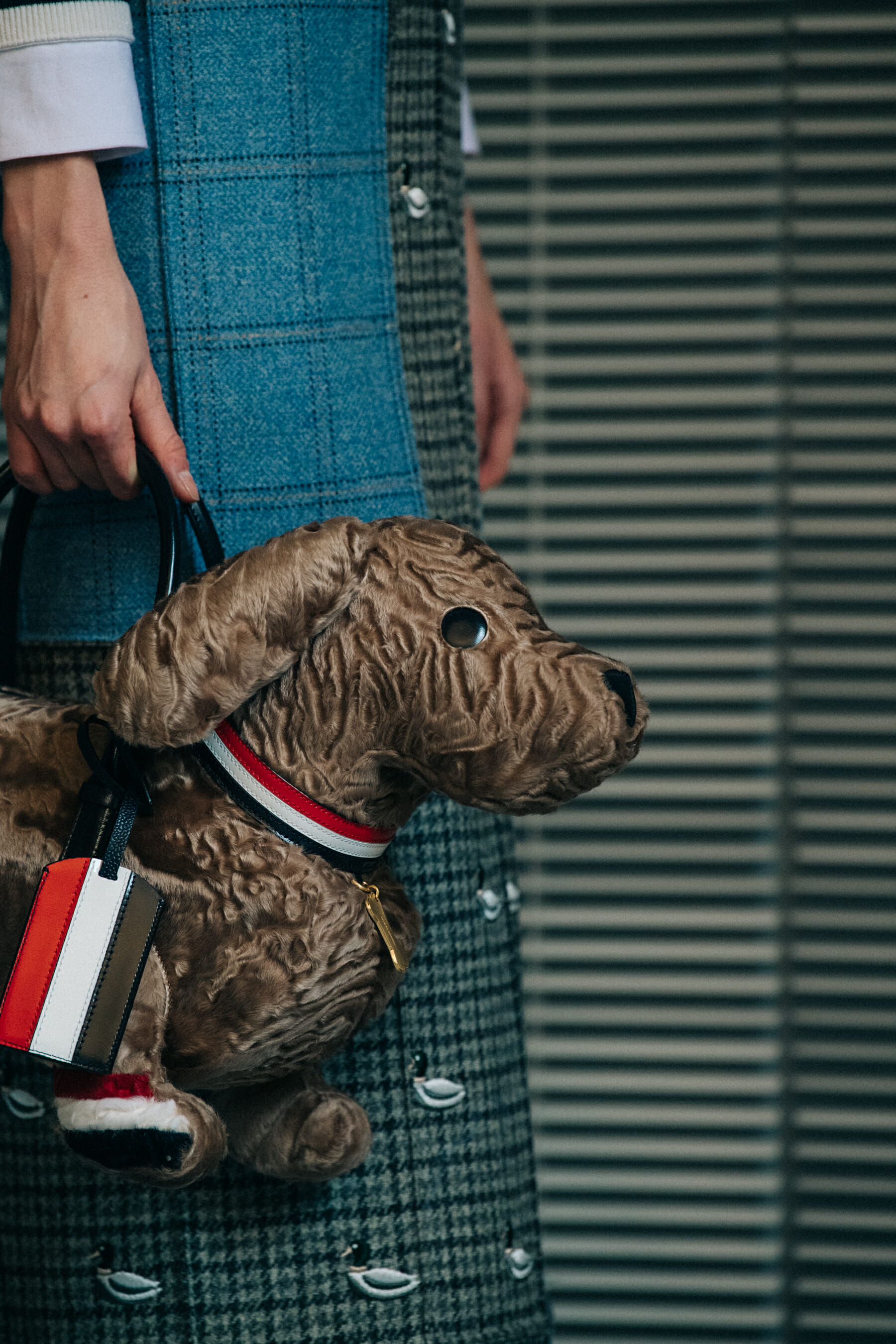 Models carrying Thom Browne bags