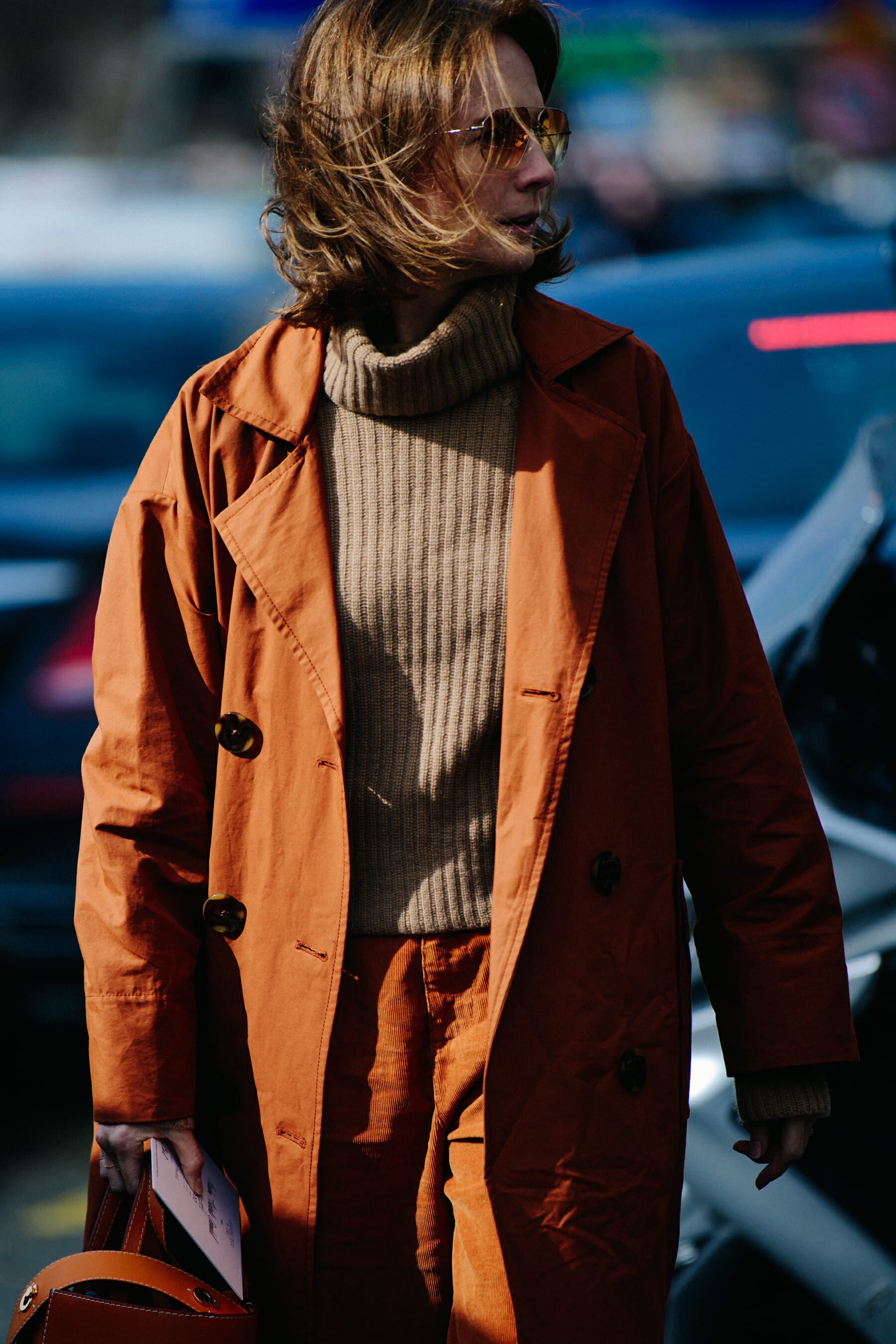 Woman wearing tan coat