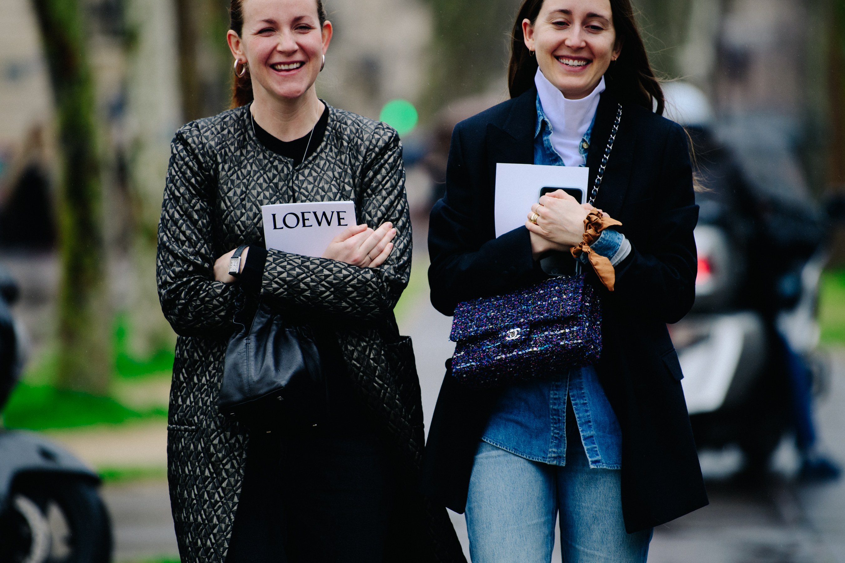 Two women wearing dark jackets