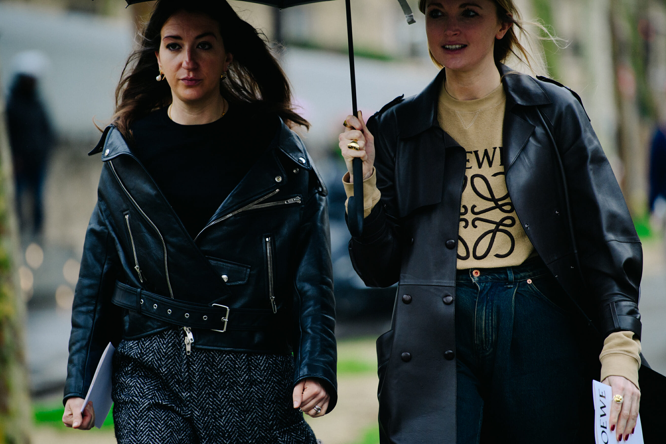 Two women wearing leather jackets