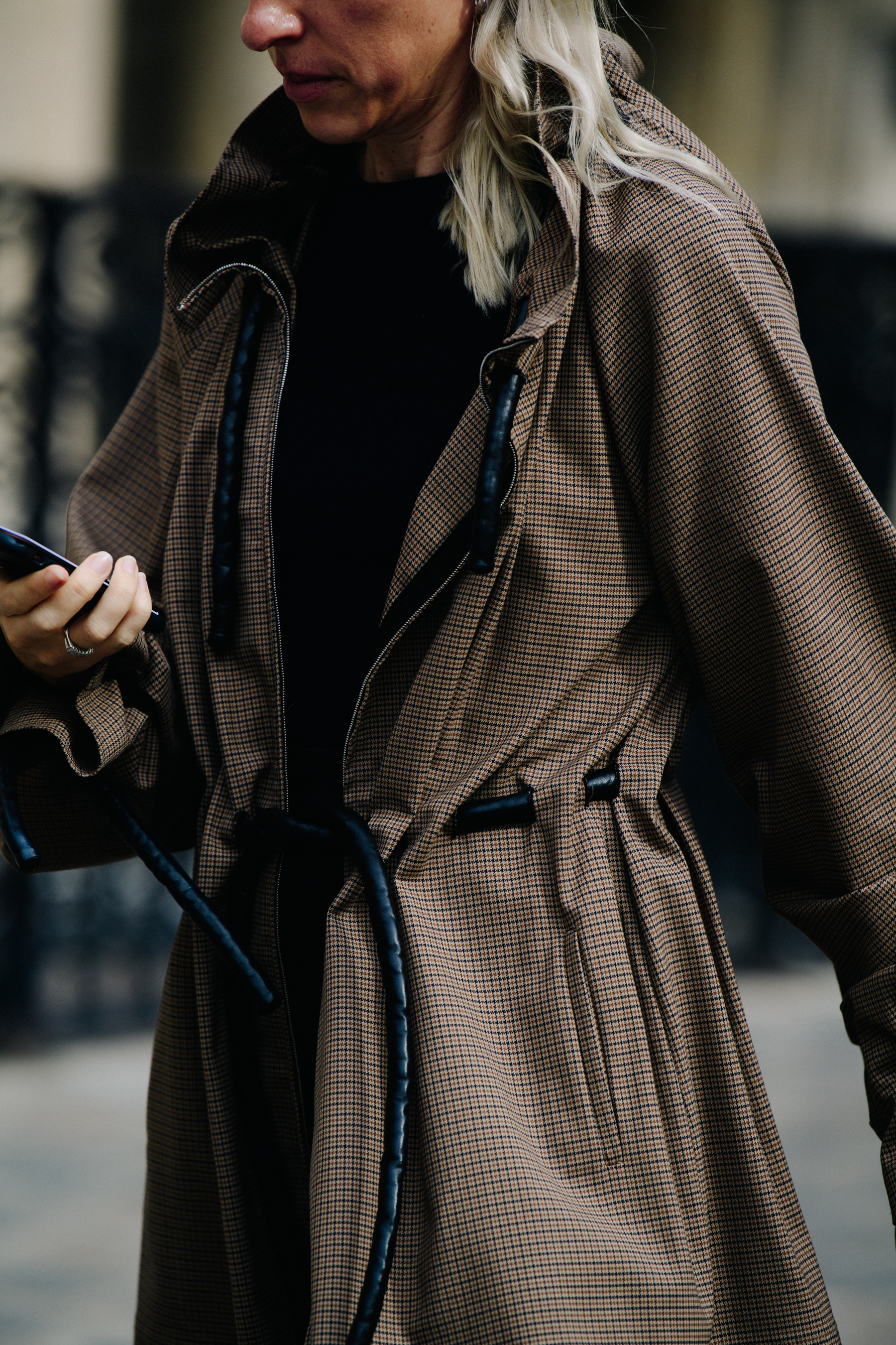 Woman wearing check coat