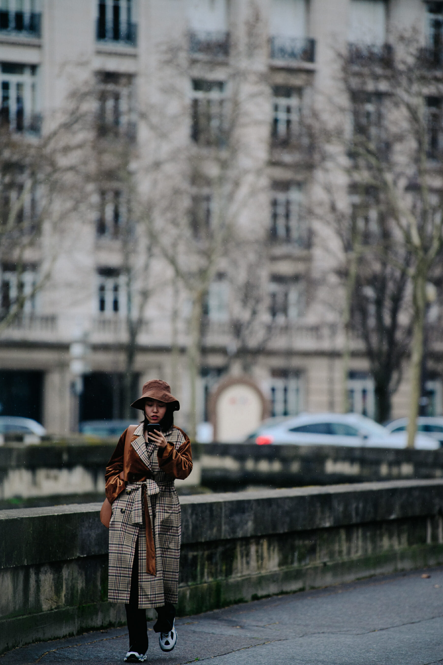 Woman wearing long check coat