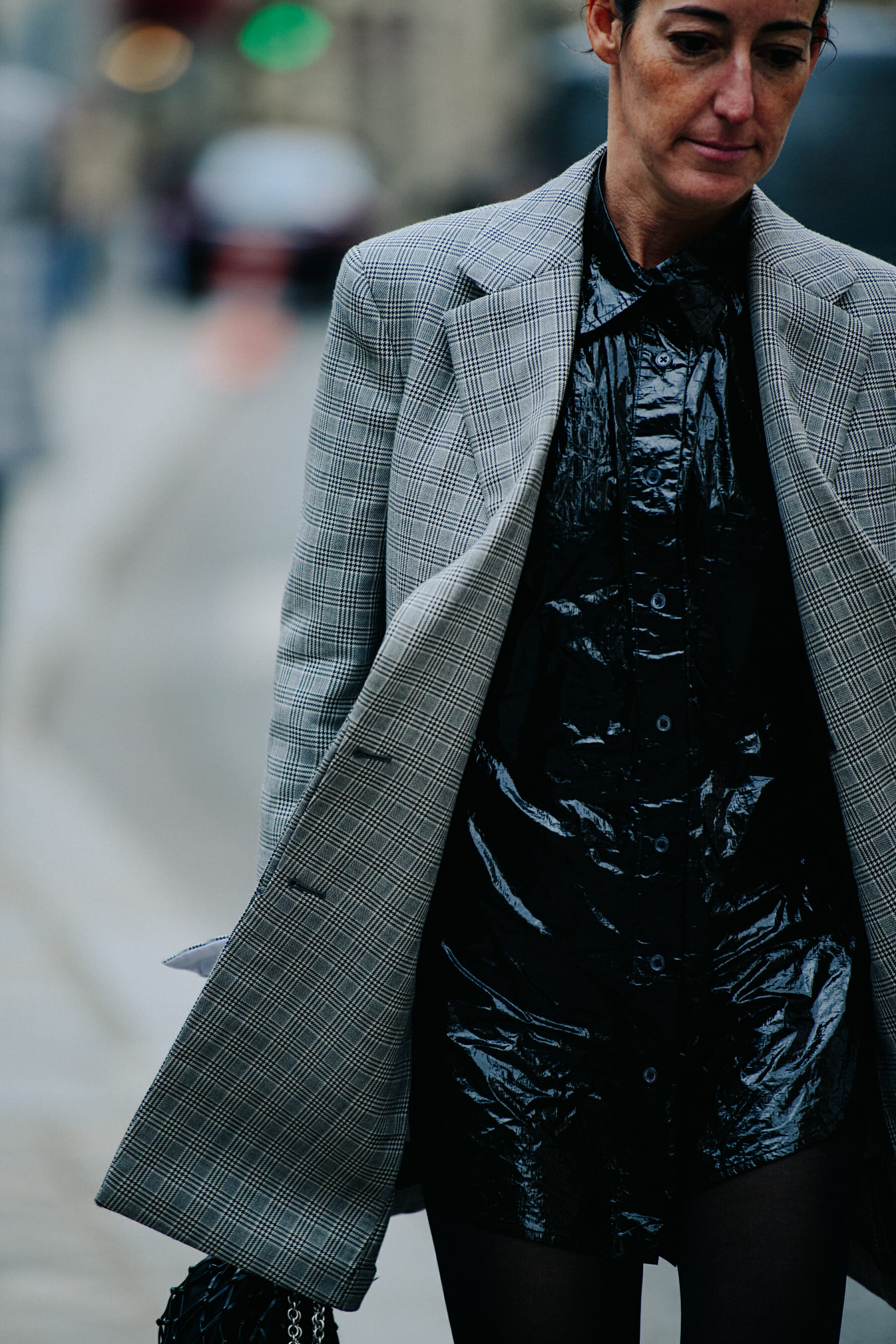 Woman wearing grey check jacket
