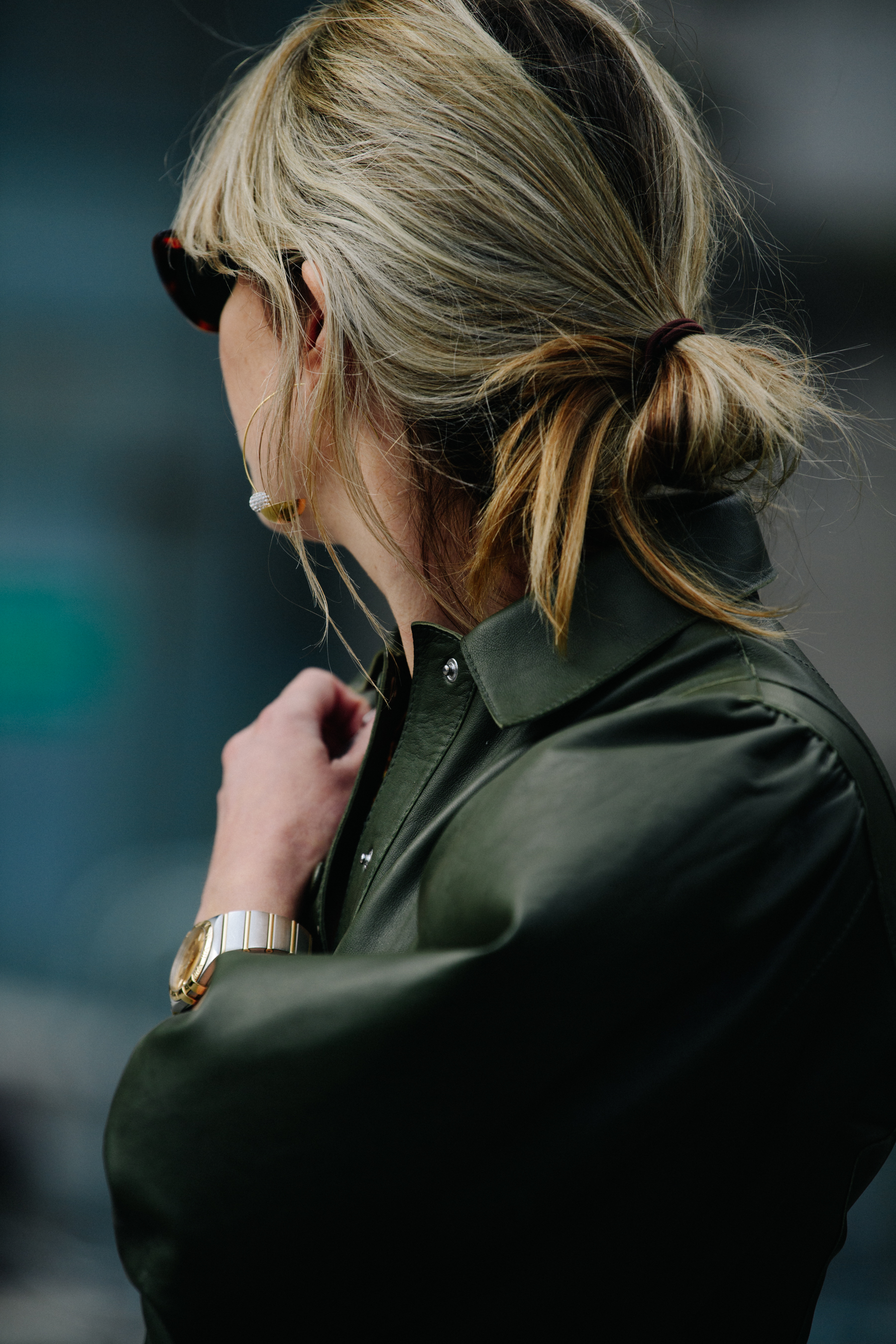 French woman wearing green leather dress