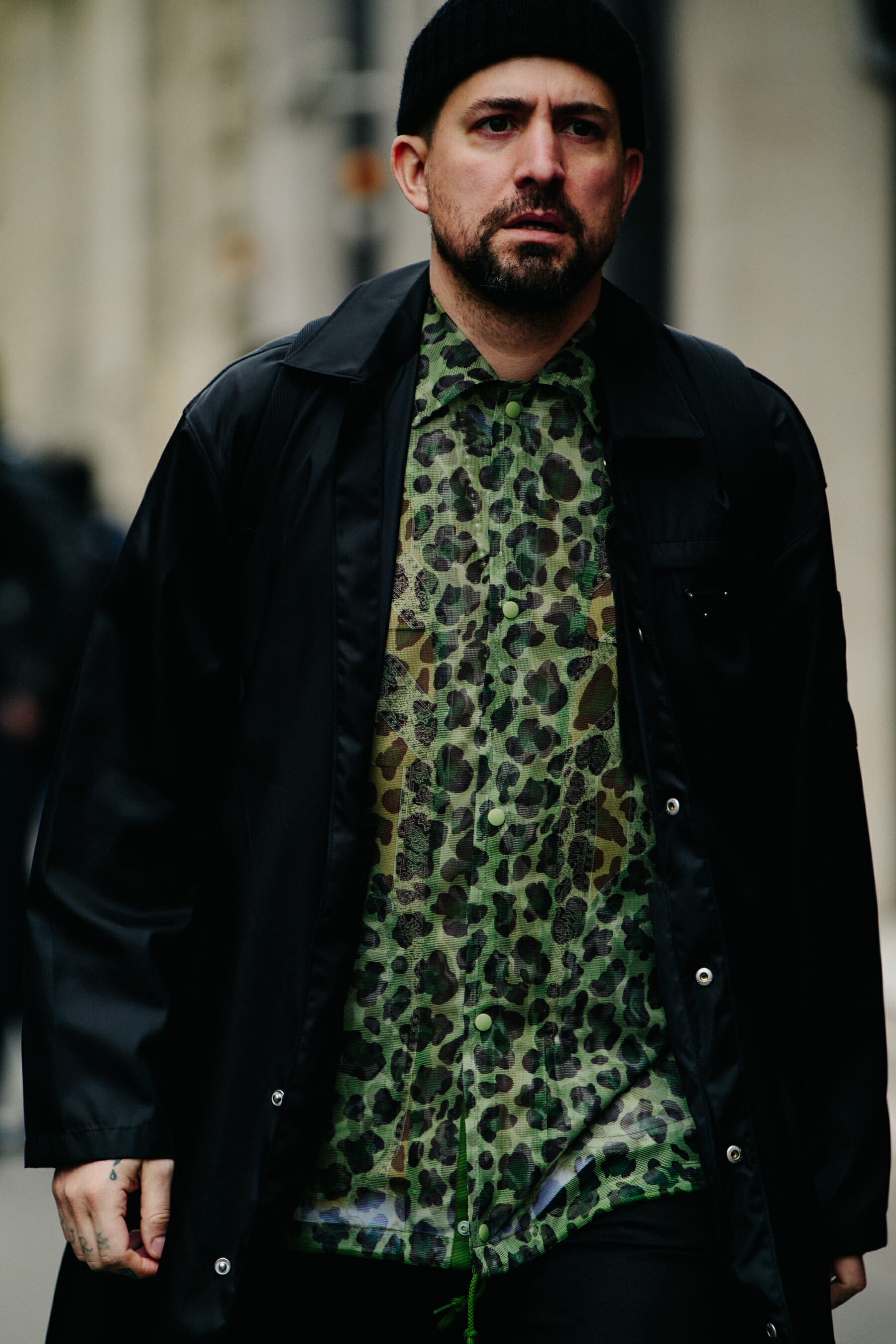Man wearing green print shirt