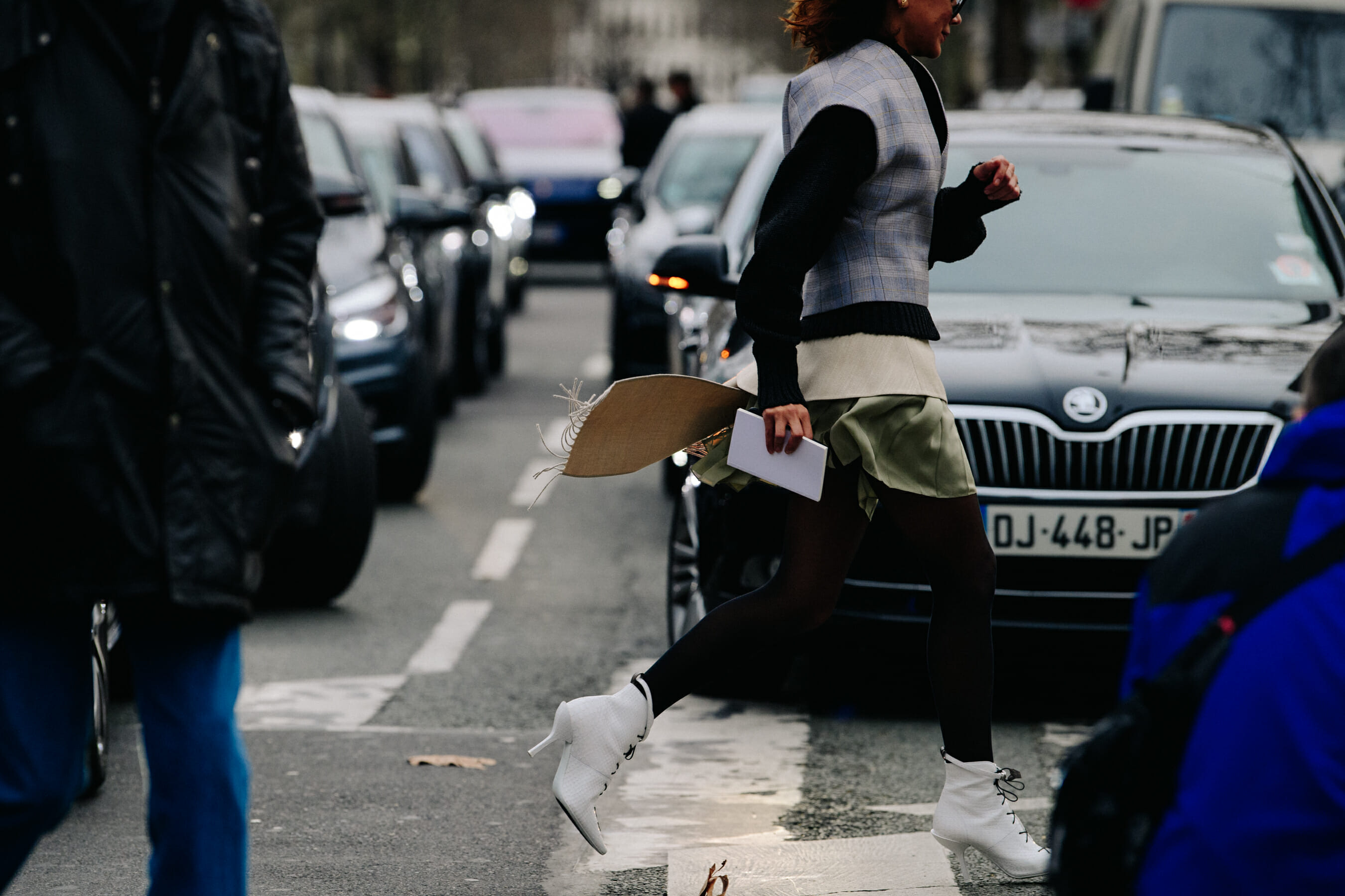 Woman wearing white boots