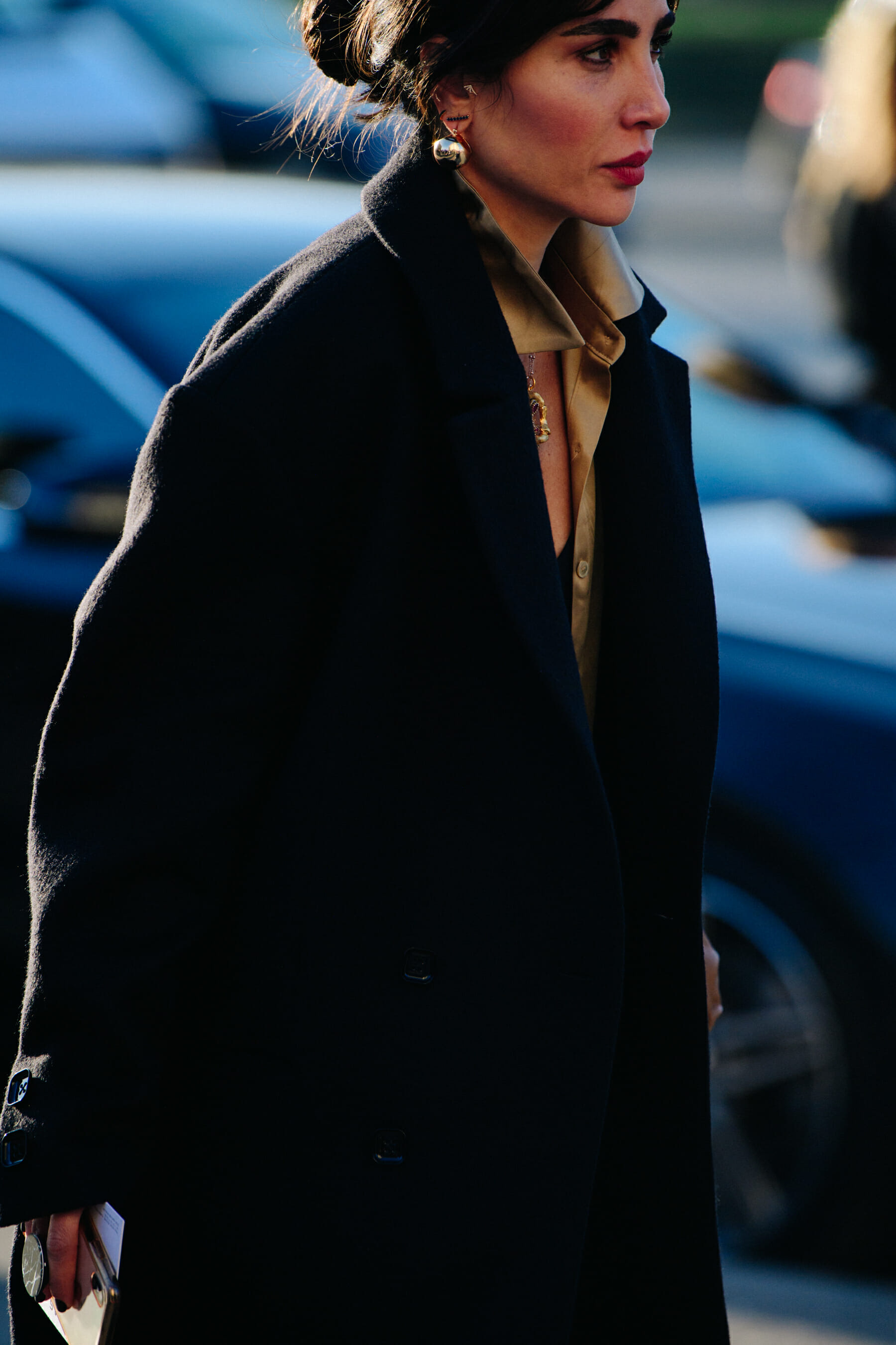 Woman wearing gold shirt