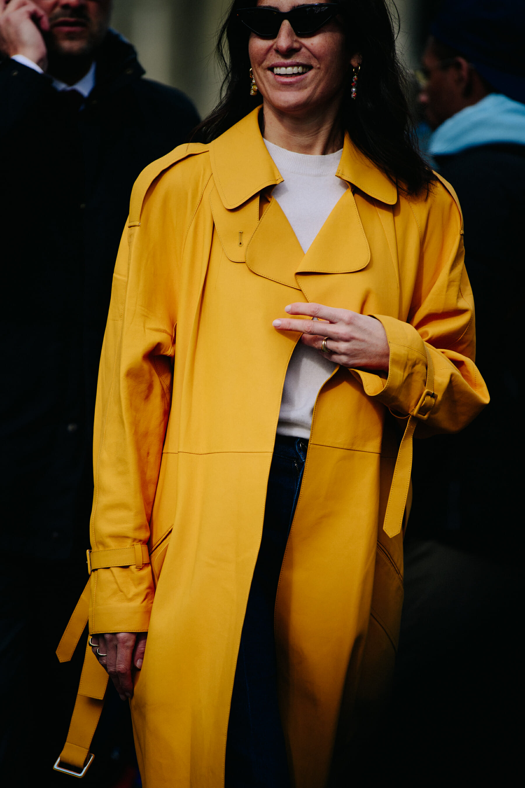 Woman wearing yellow leather coat