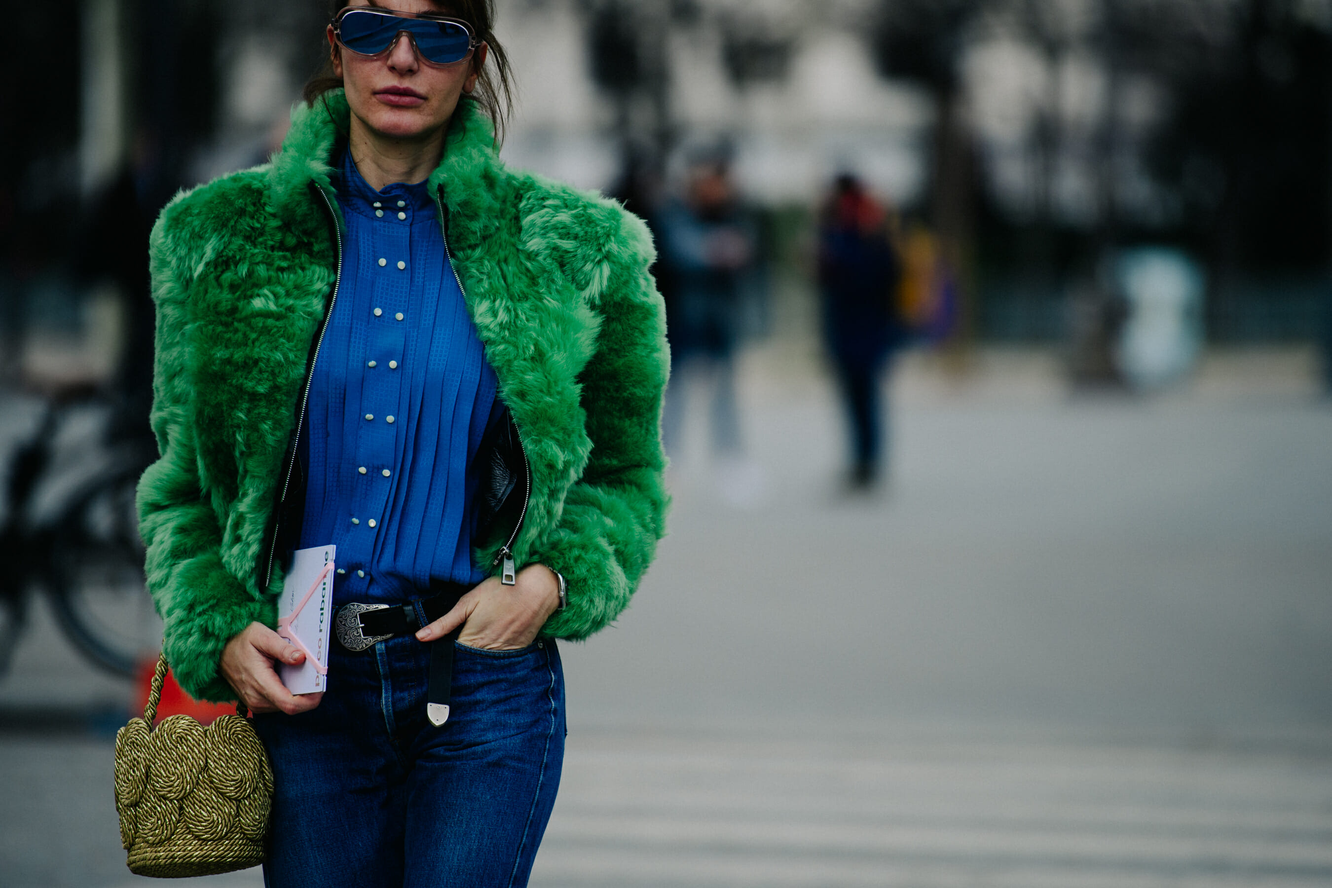 Woman wearing green fur jacket