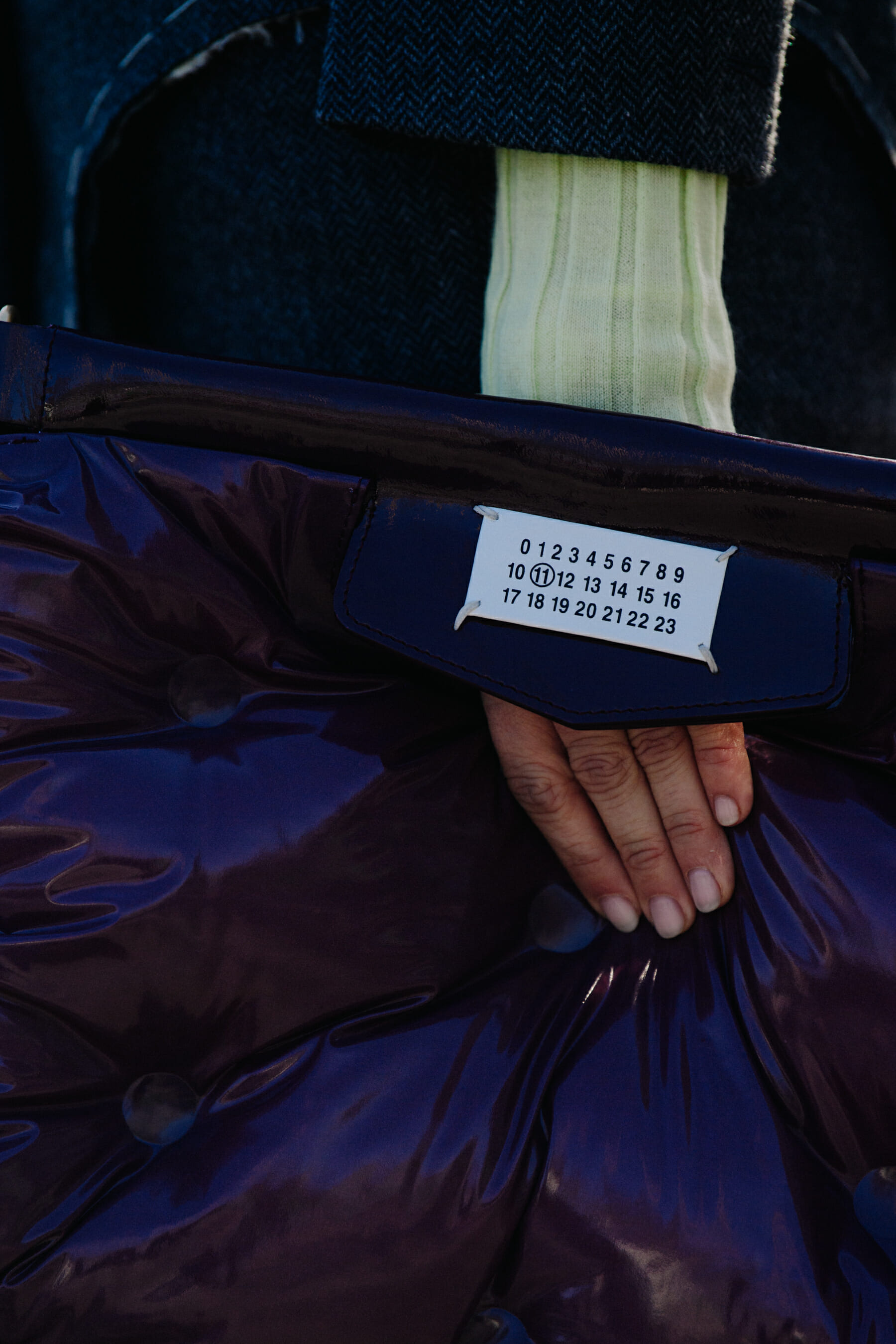 Woman carrying Margiela bag