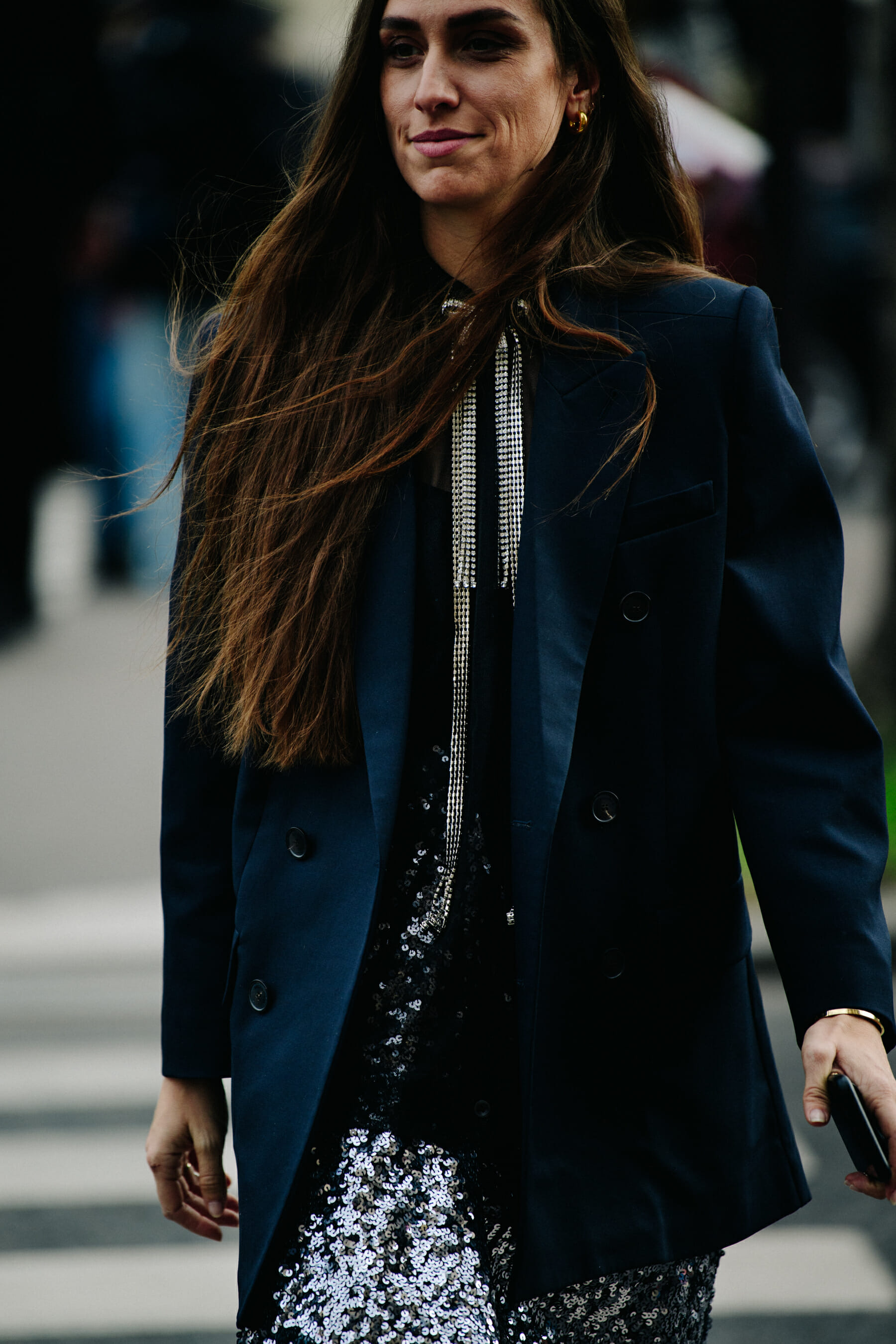 Woman wearing long silver necklace