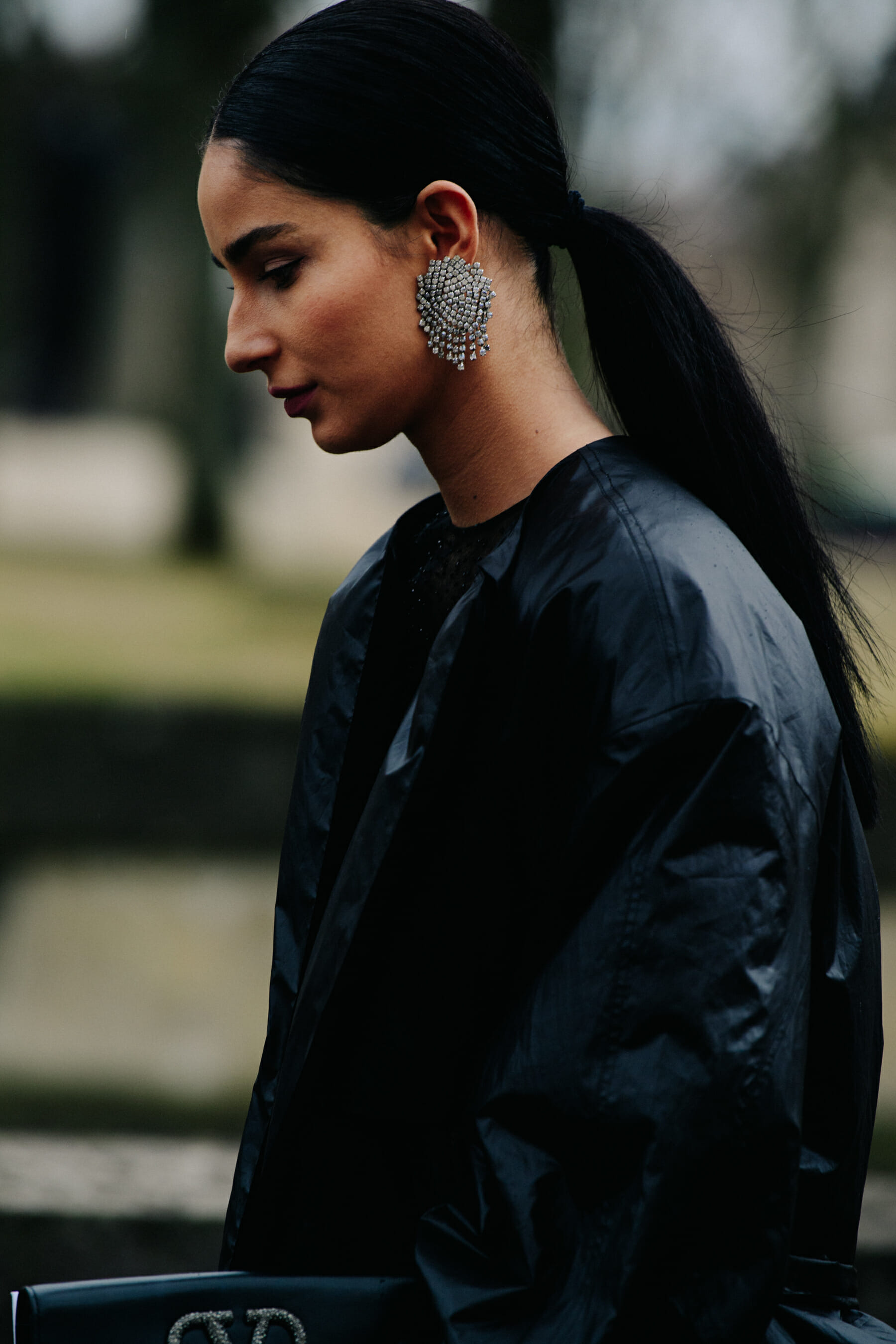 Woman wearing large silver earring