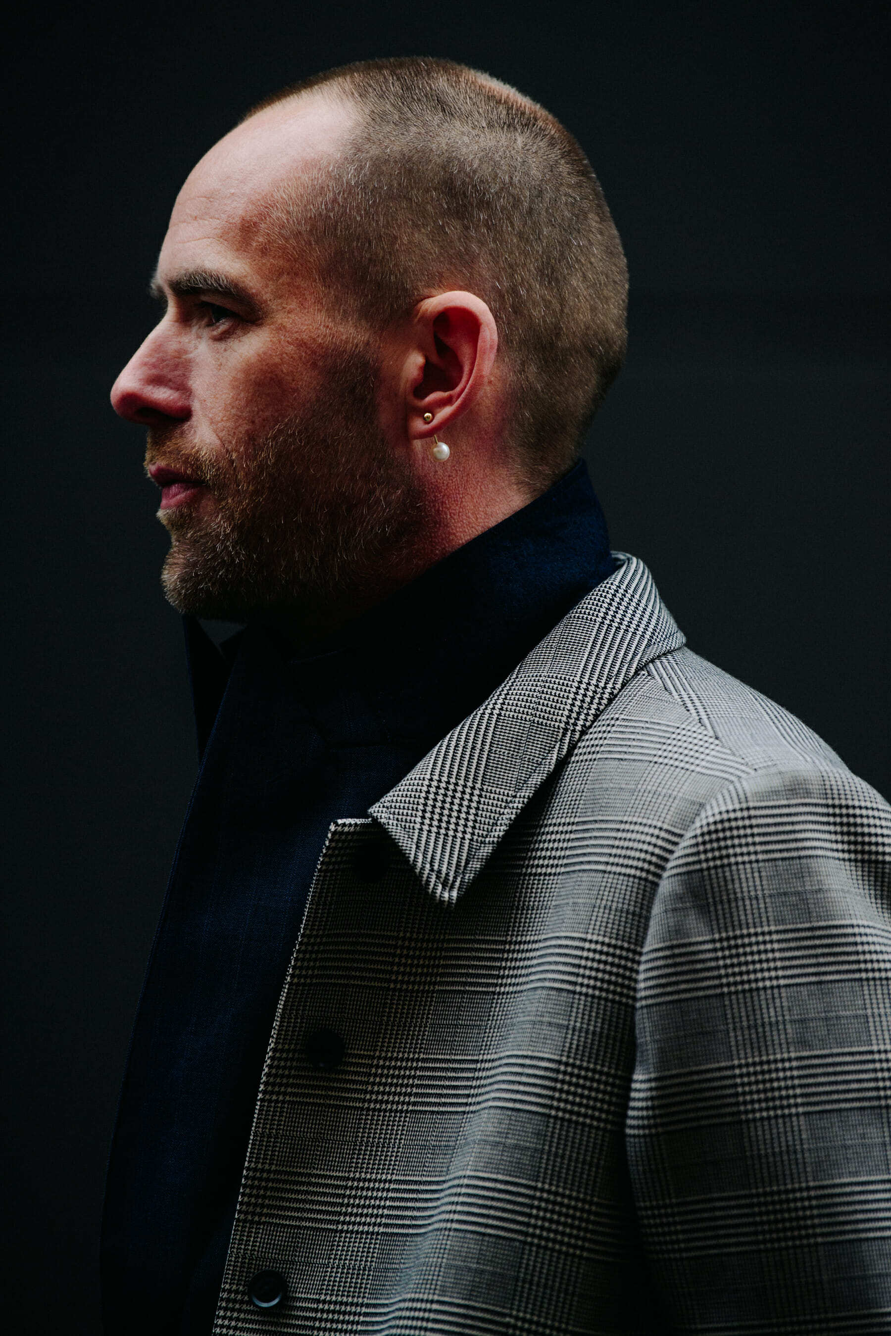 Man wearing grey coat