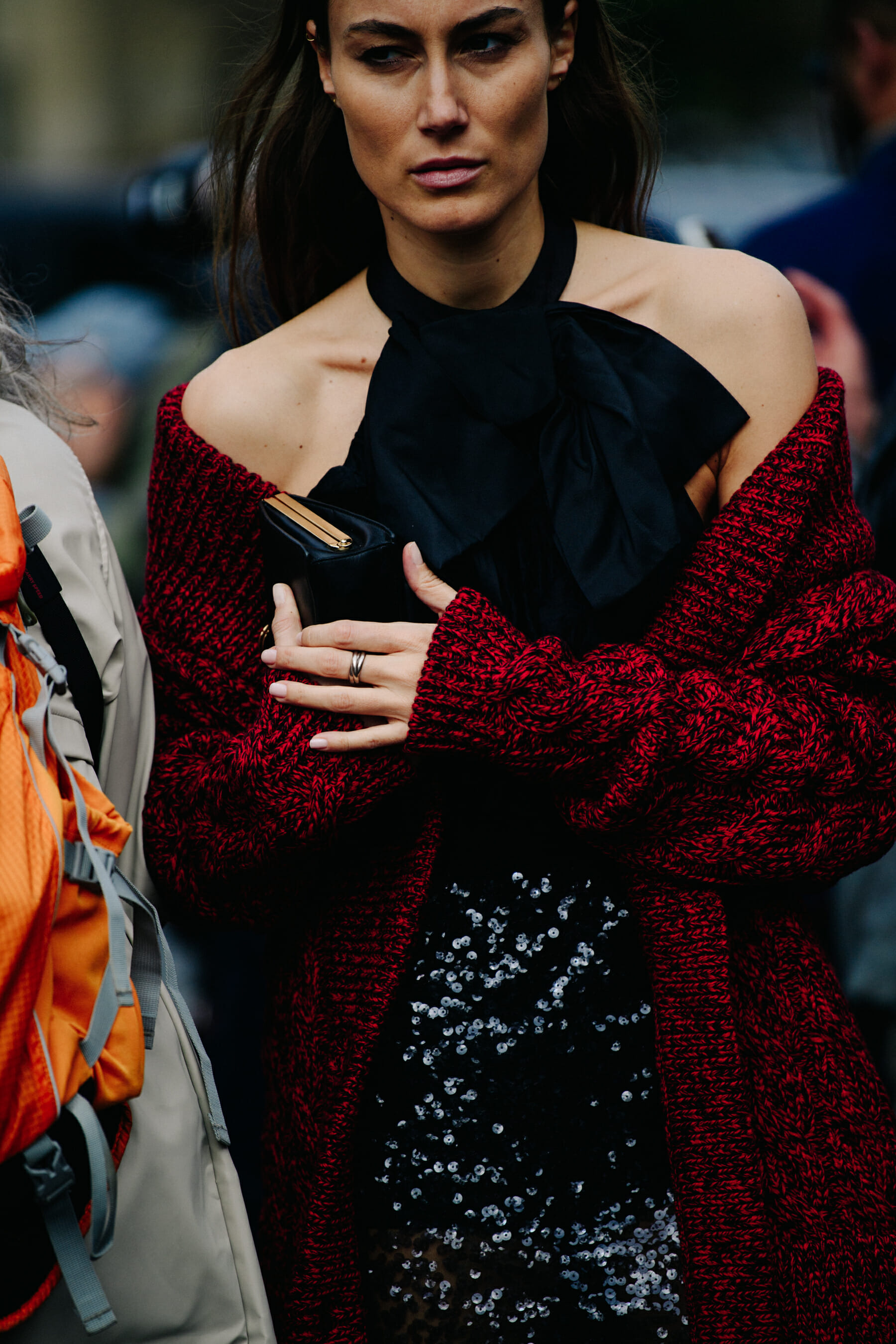 Woman wearing red cardigan