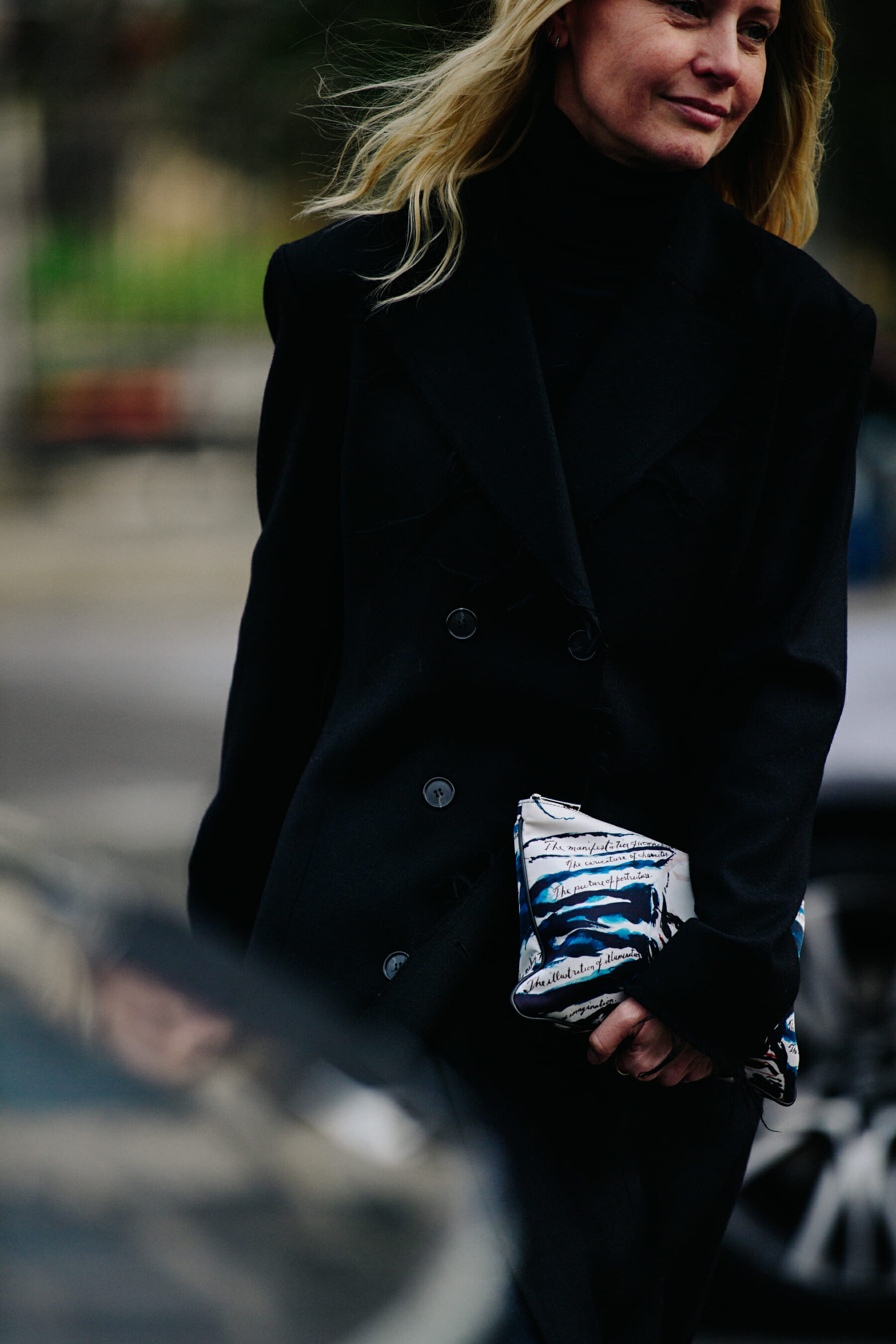 Woman wearing long black coat
