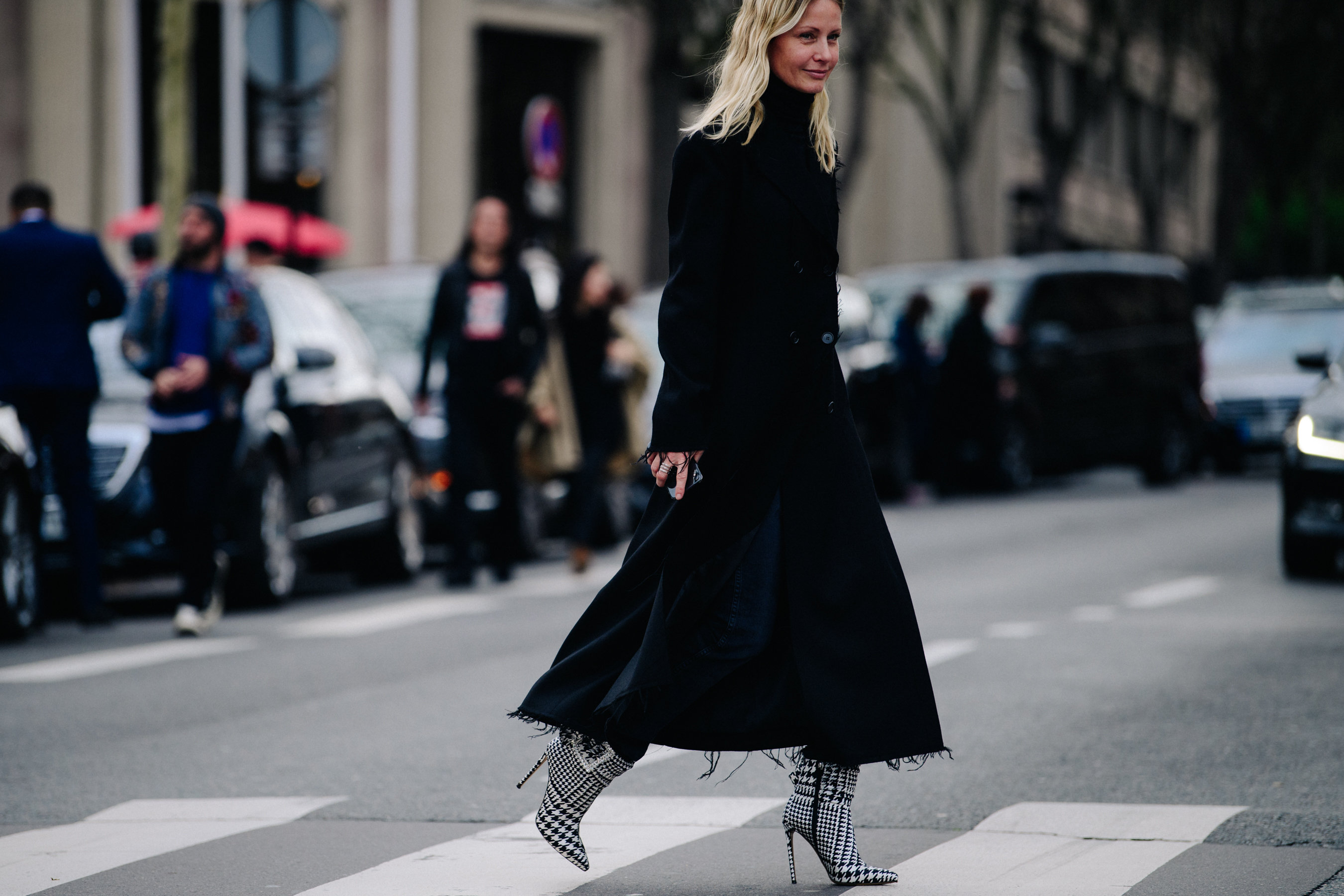 Woman wearing long black coat