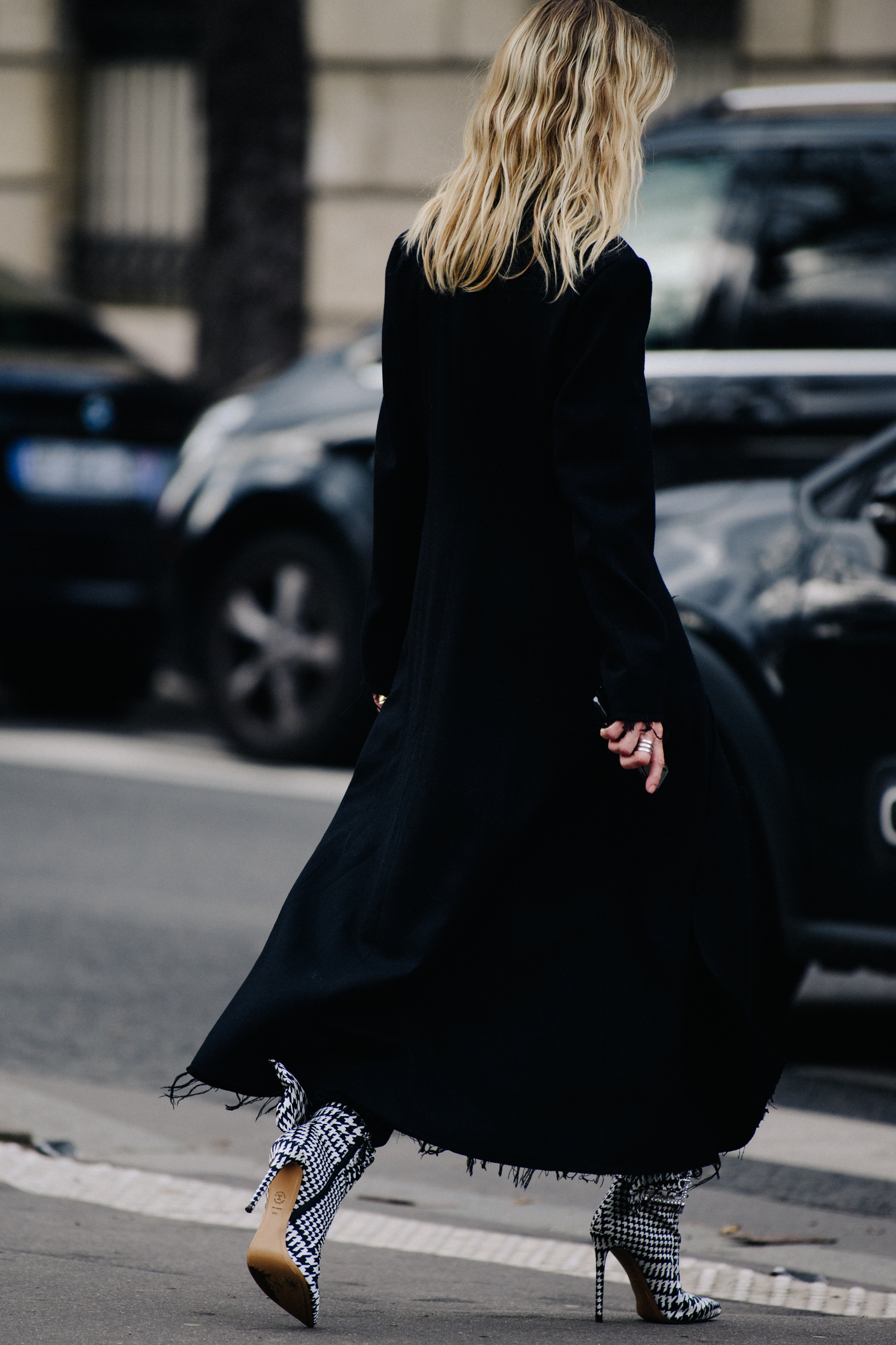 Woman wearing long black coat