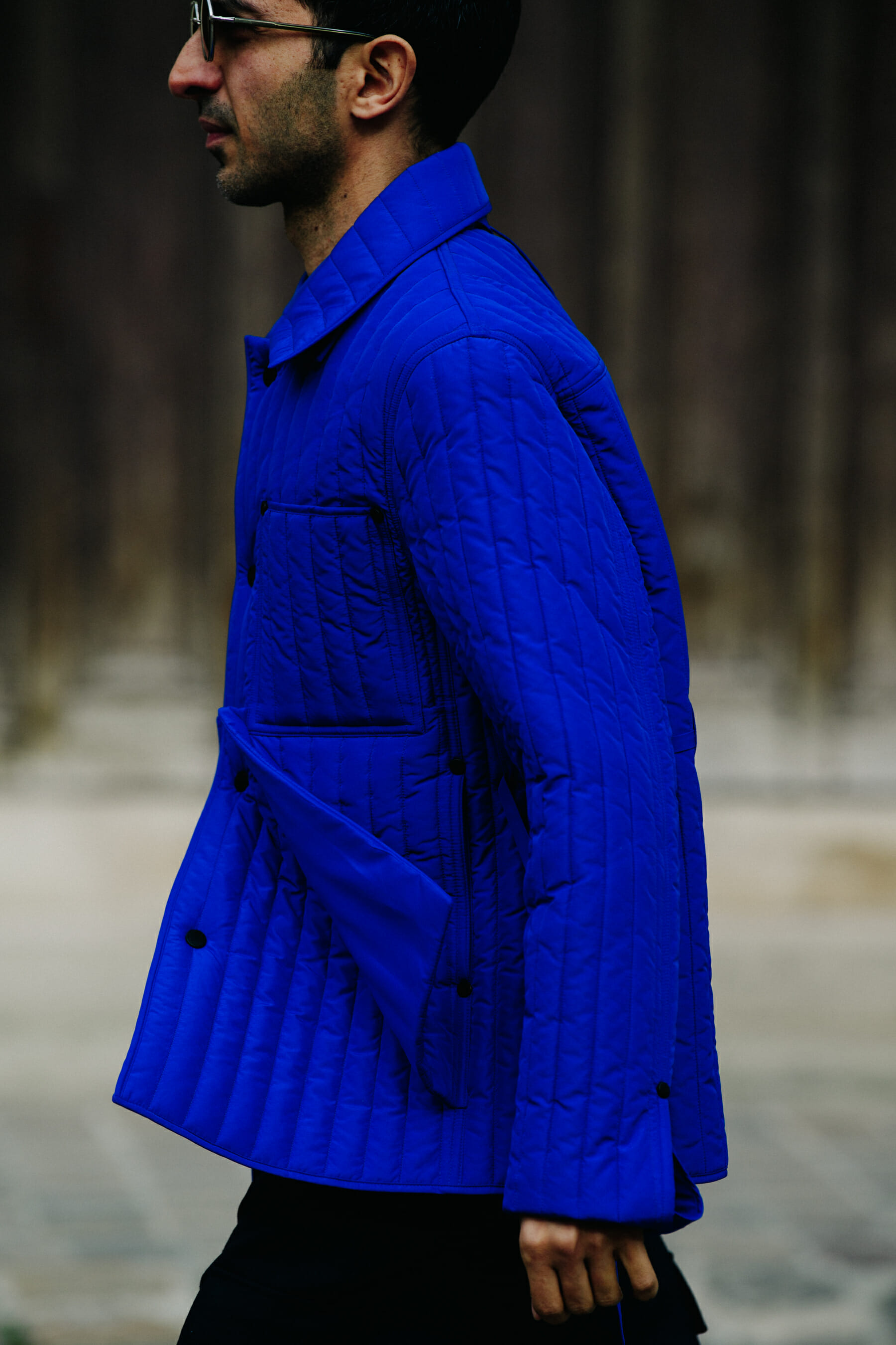 Man wearing blue Craig Green jacket