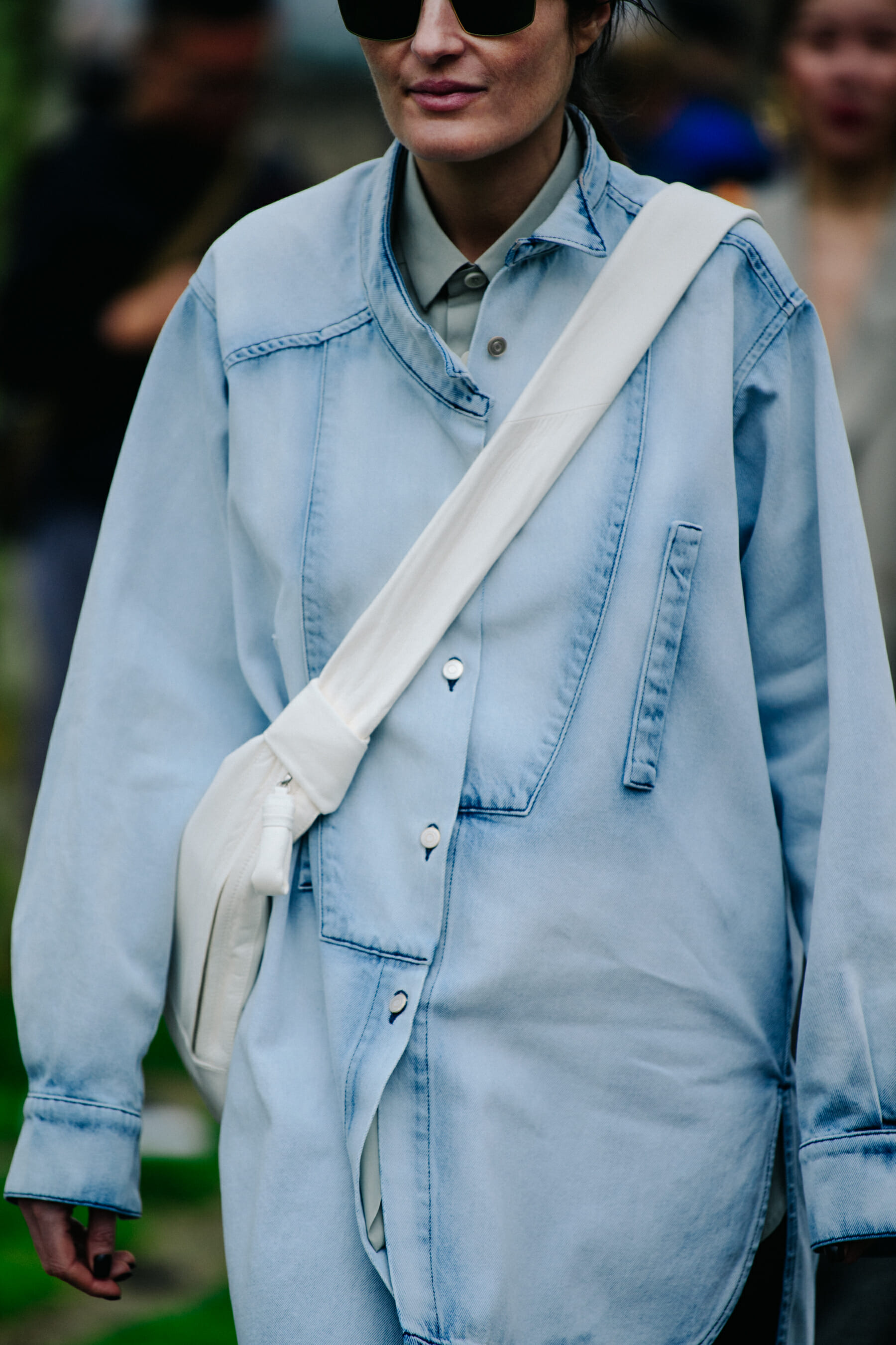 Woman wearing pale denim top