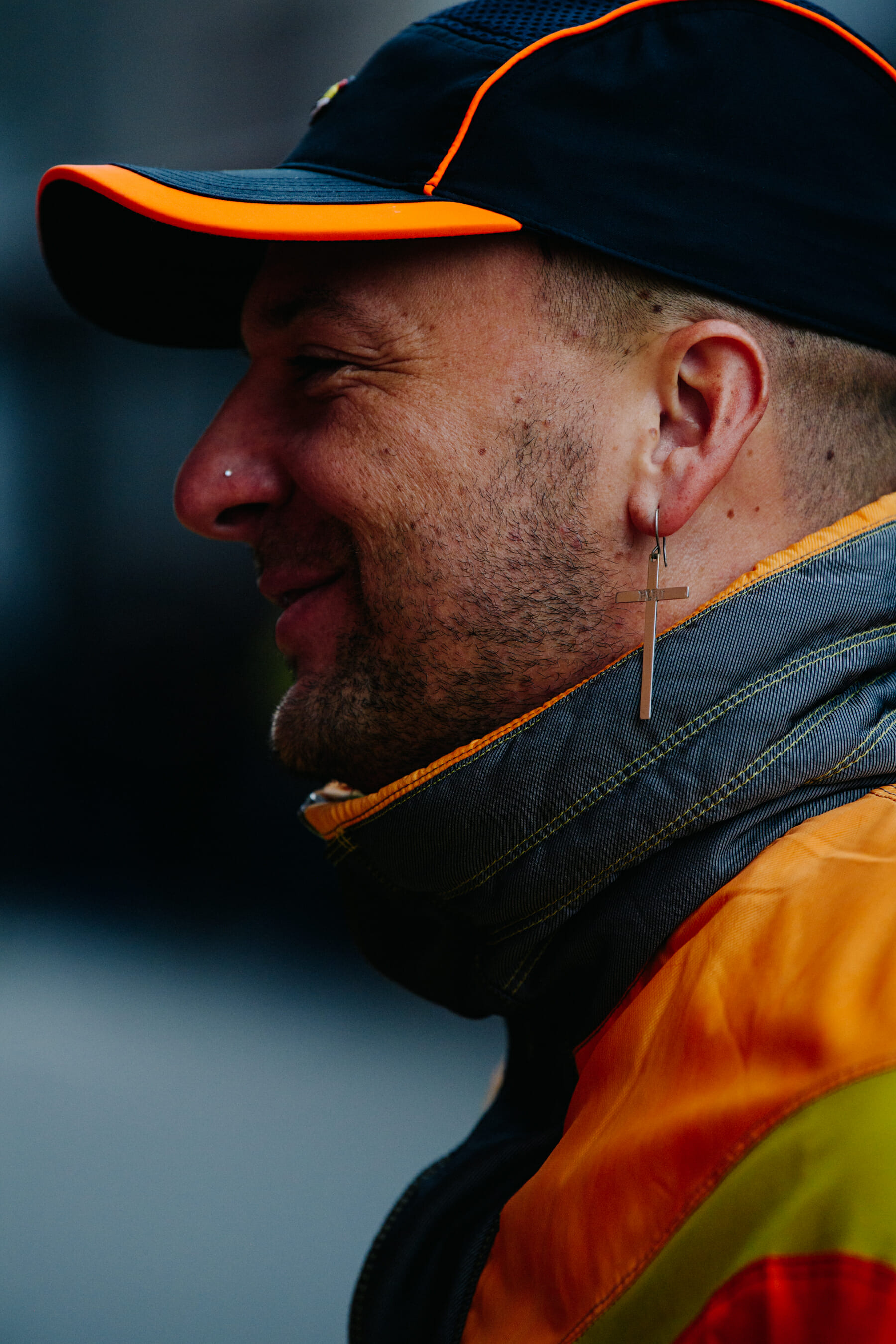 French man wearing orange cap