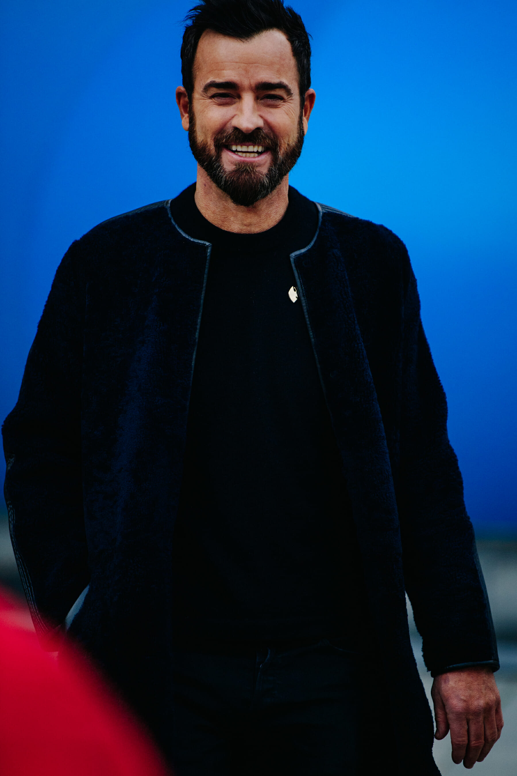 Actor wearing dark outfit