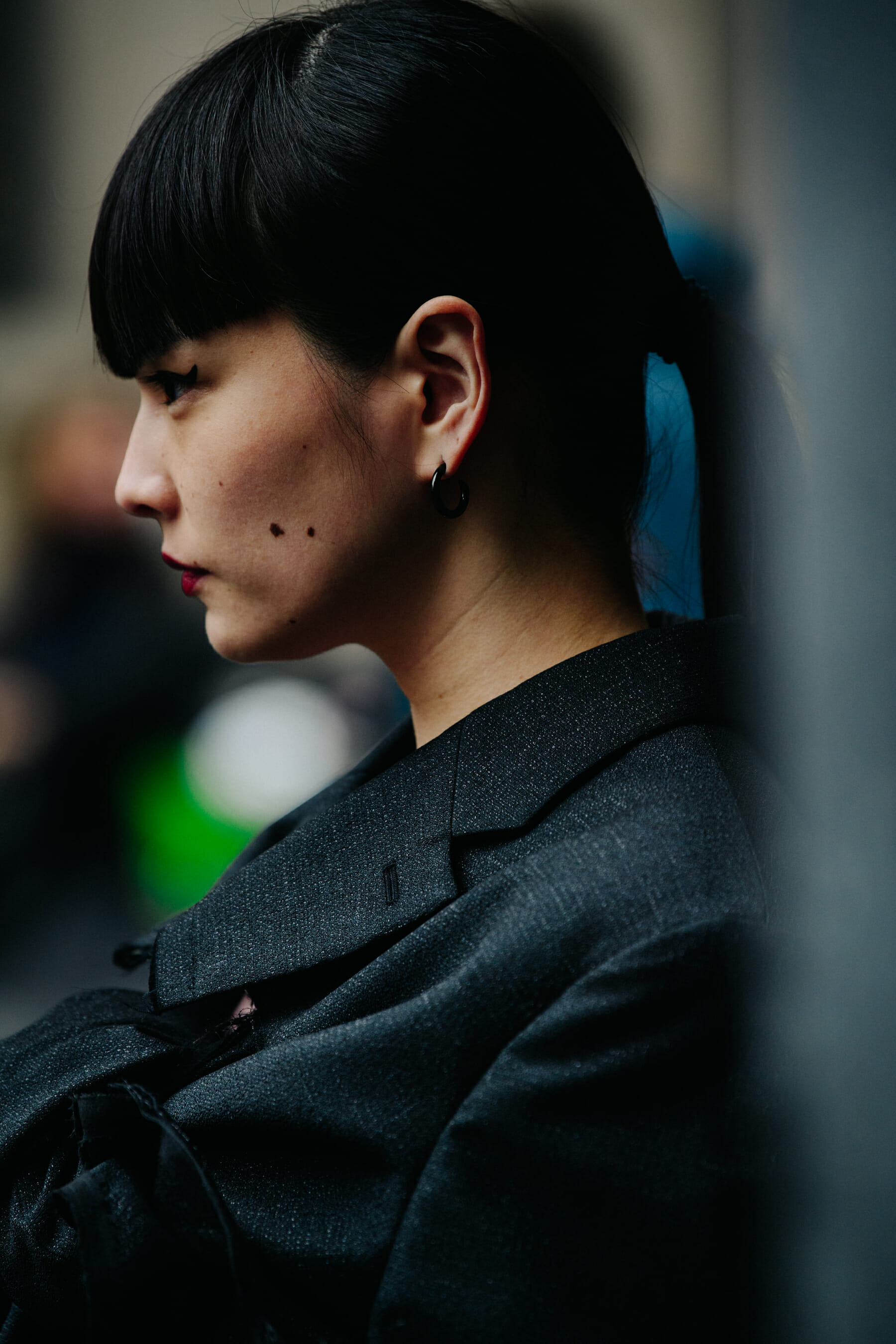 Japanese woman wearing dark grey jacket