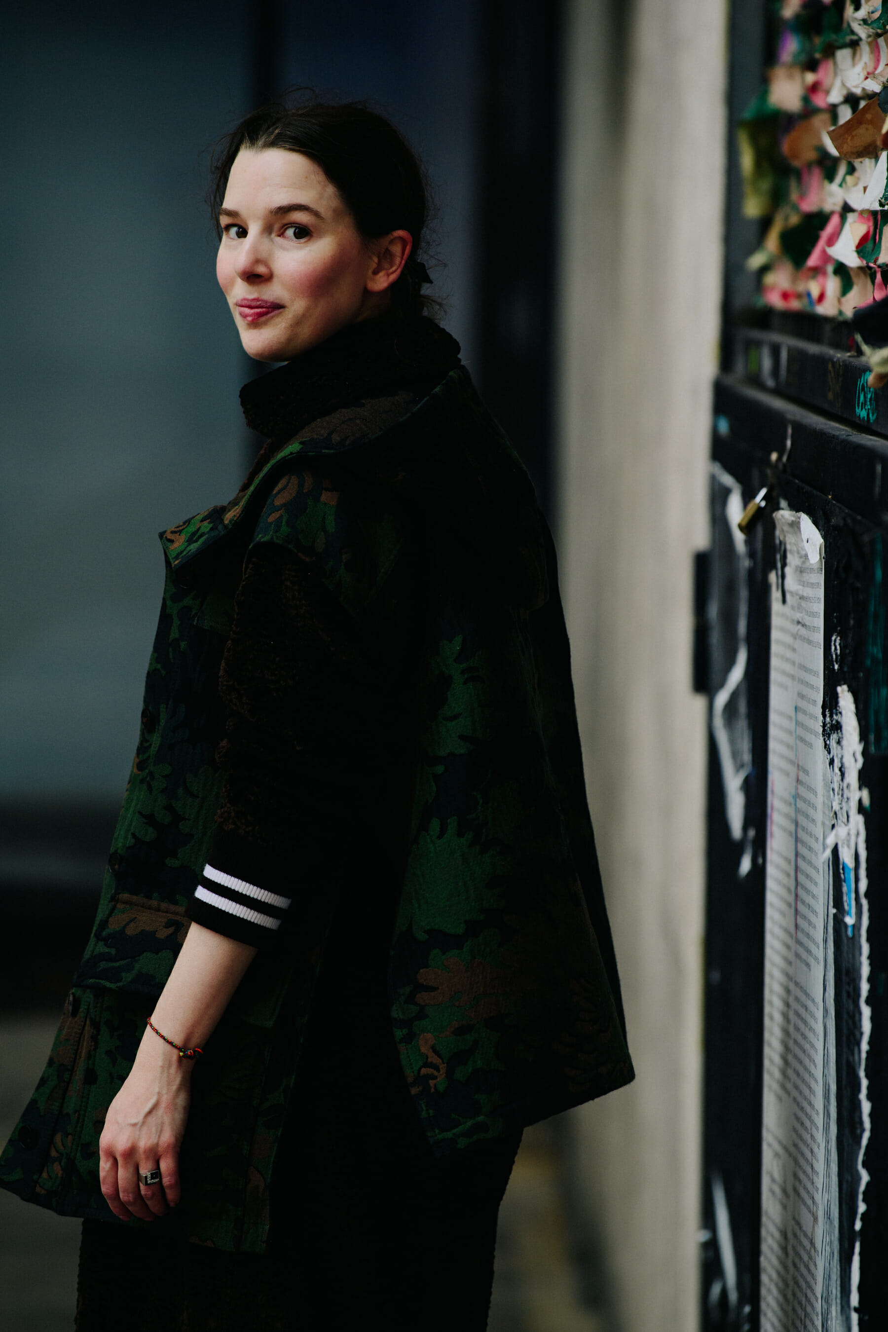 Woman wearing green jacket