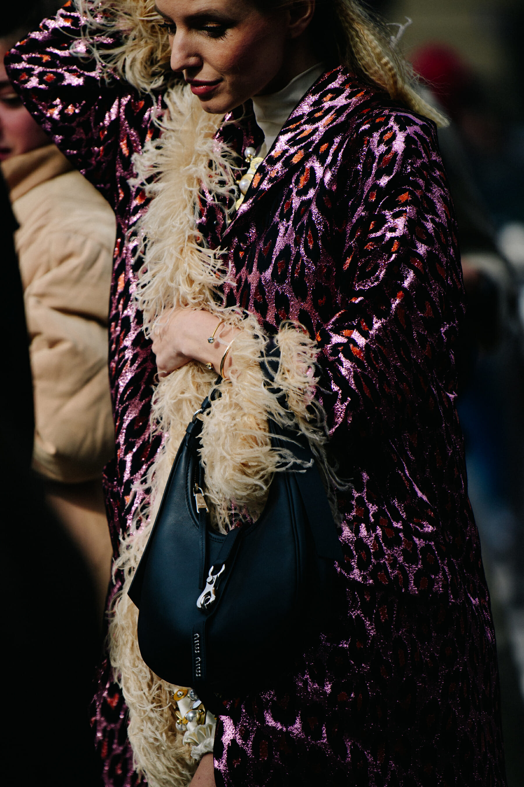 Woman wearing purple glitter coat