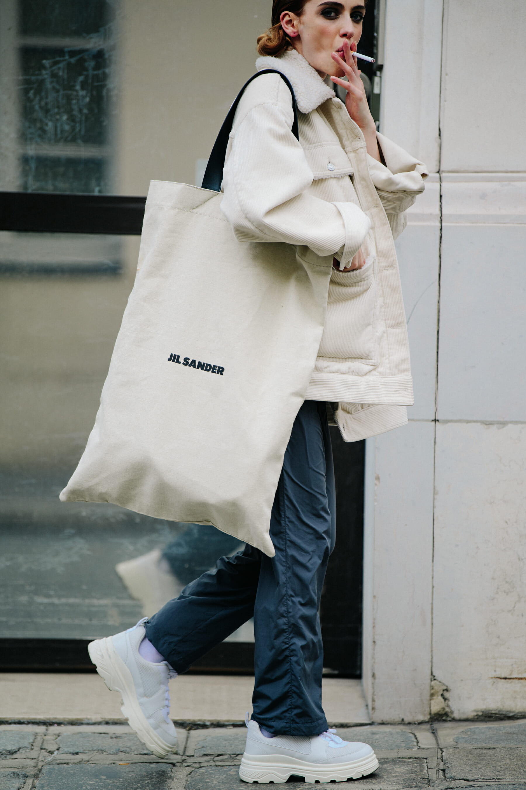 Model wearing white jacket