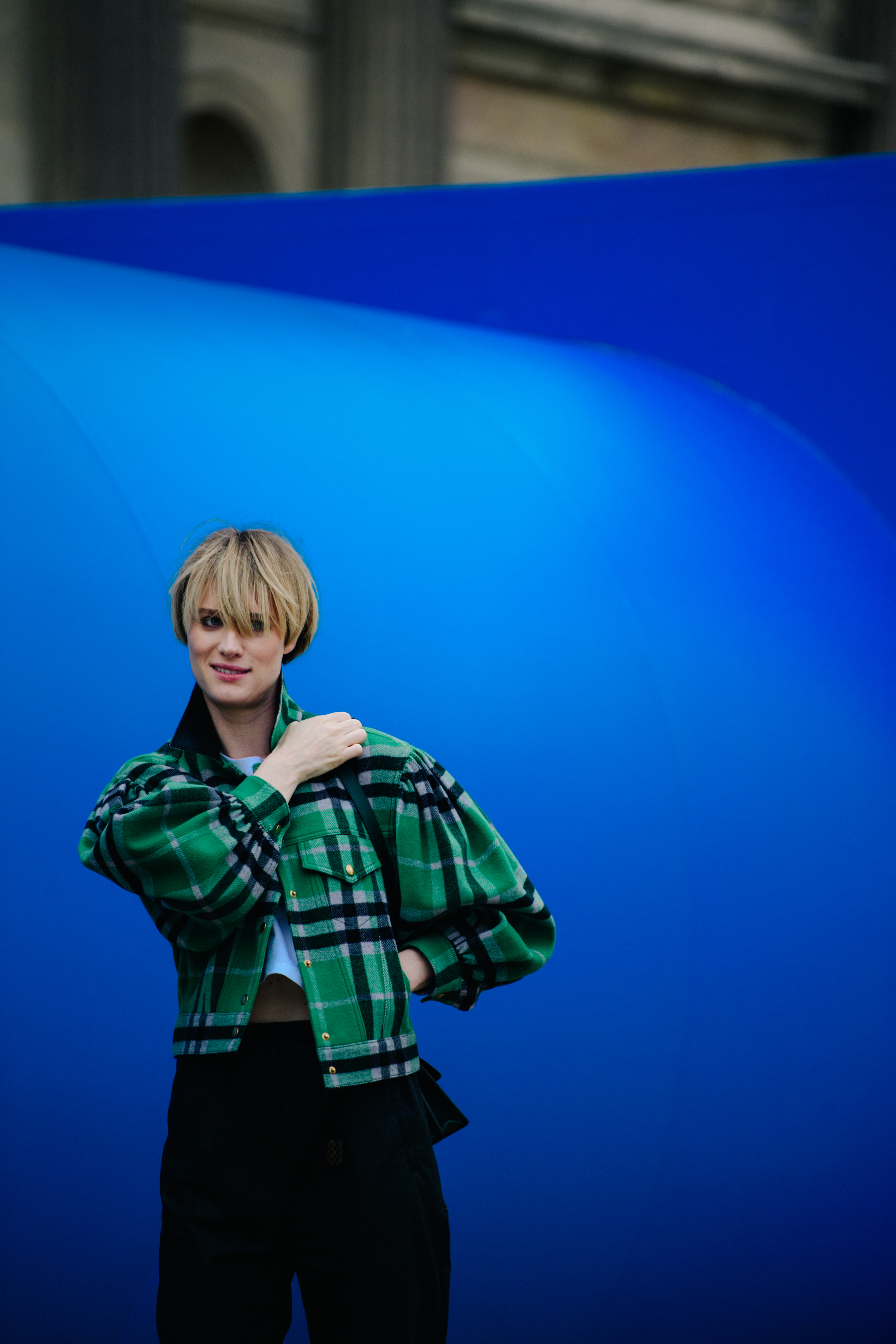 Woman wearing green check jacket