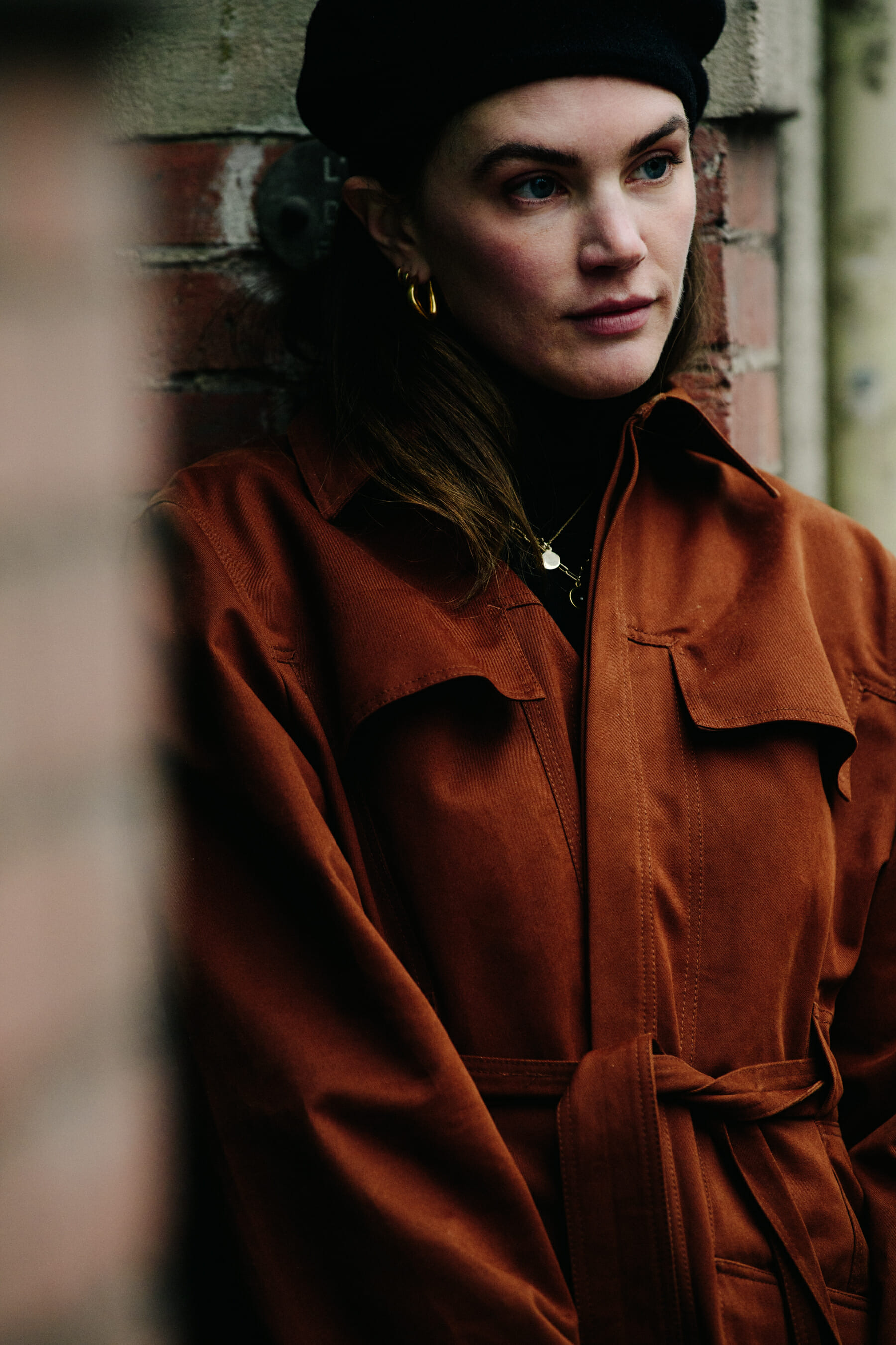 Woman wearing brown coat