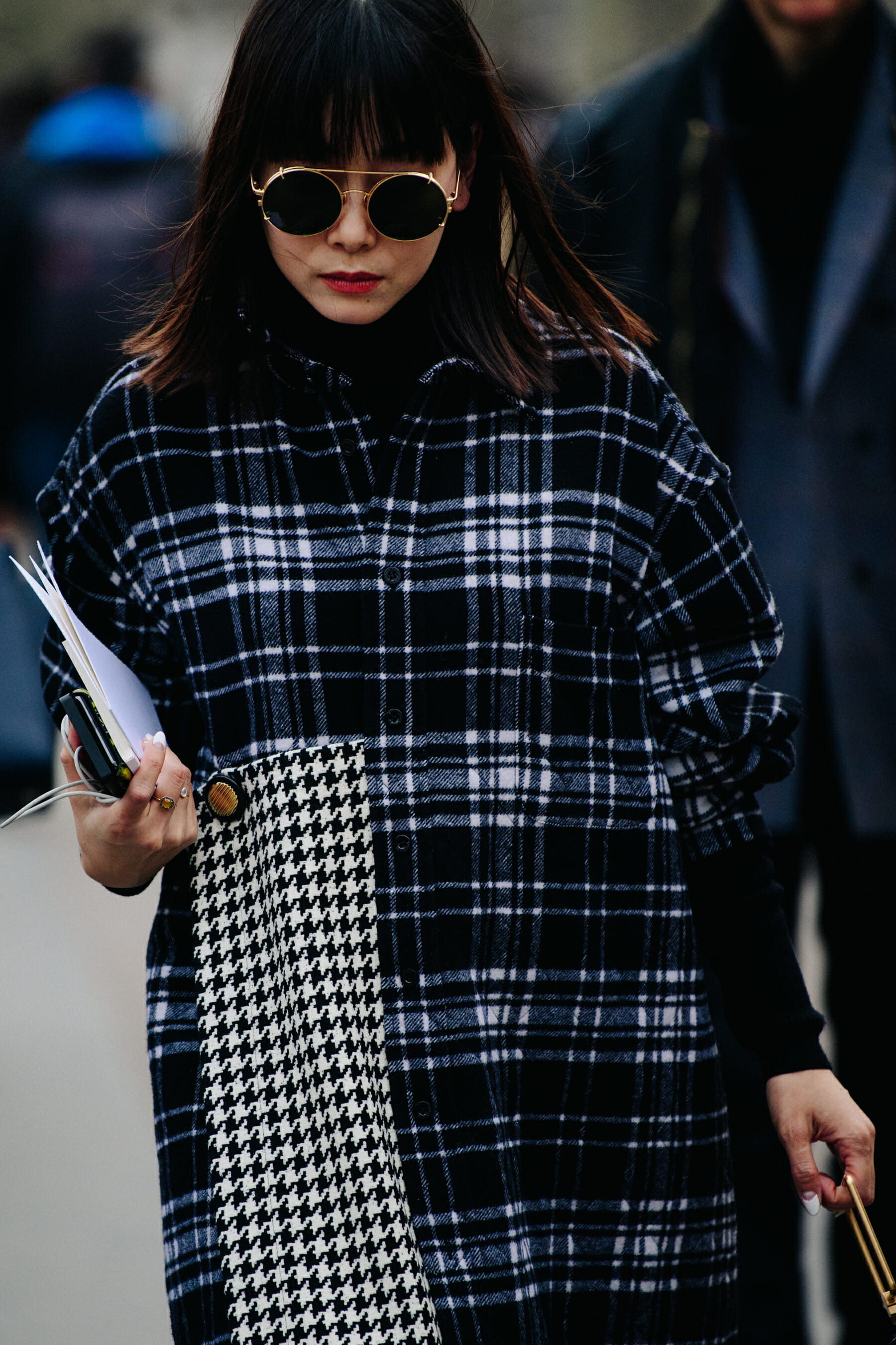 Woman wearing check coat