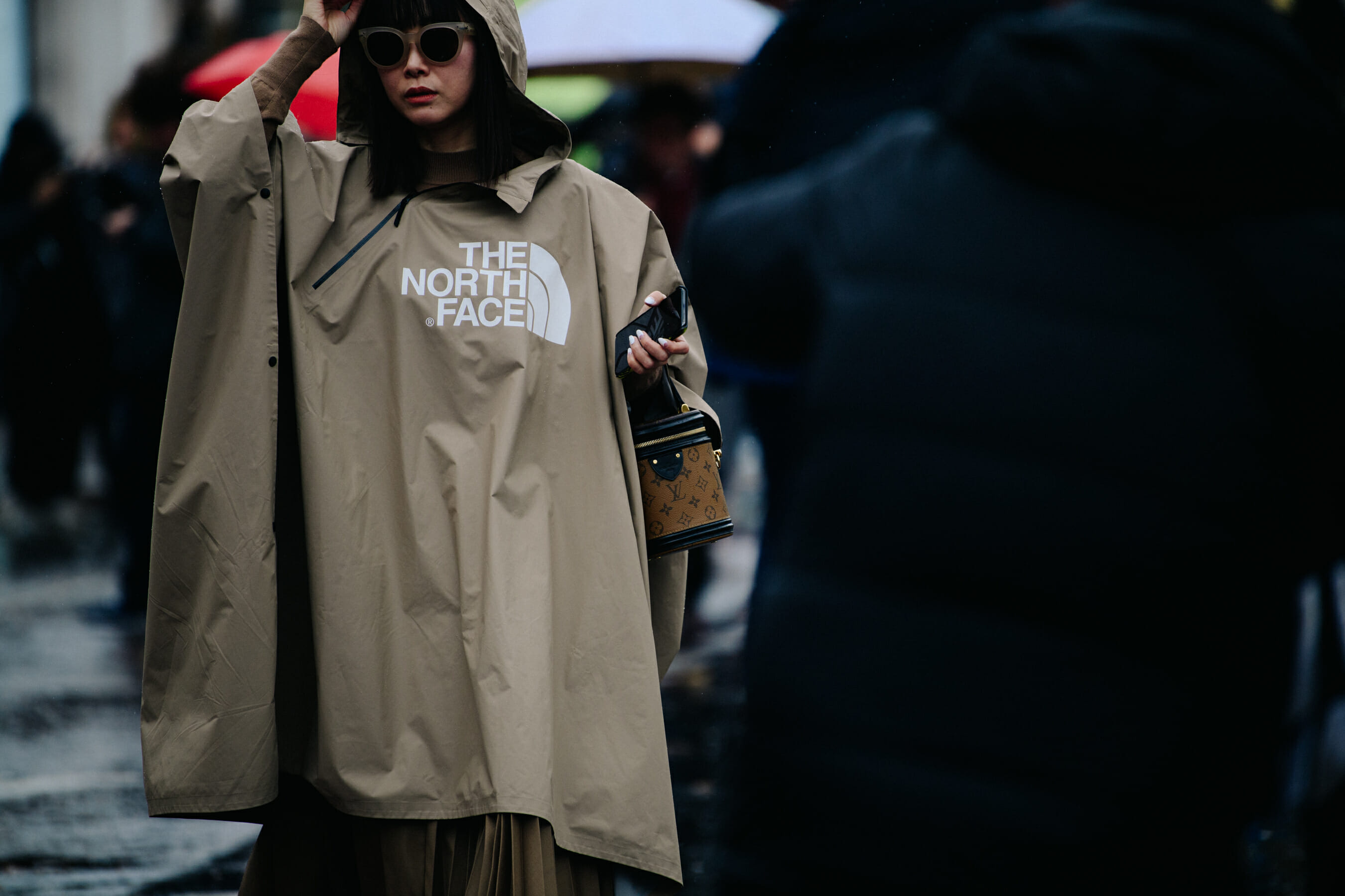 Woman wearing The North Face poncho