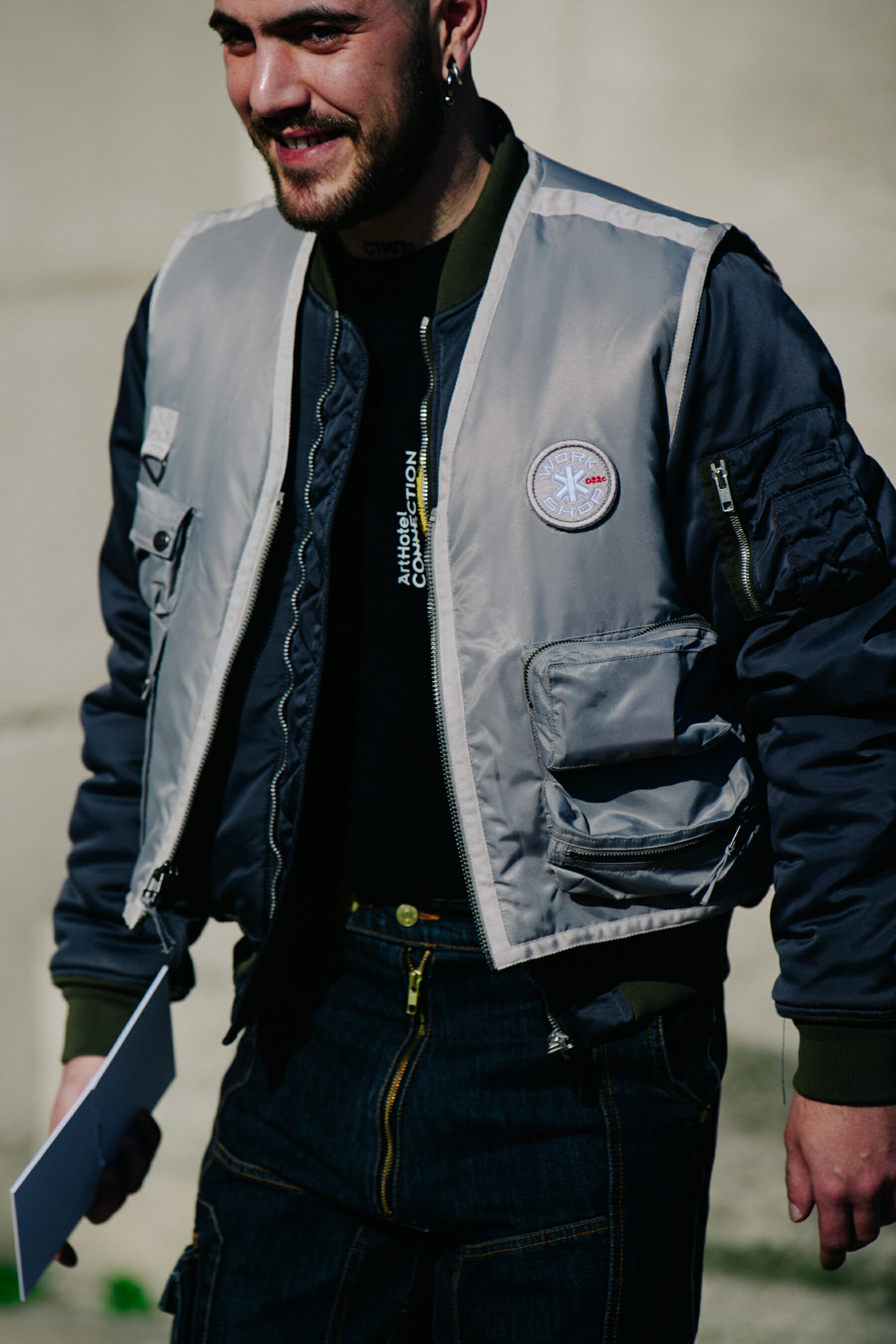 German man wearing grey vest