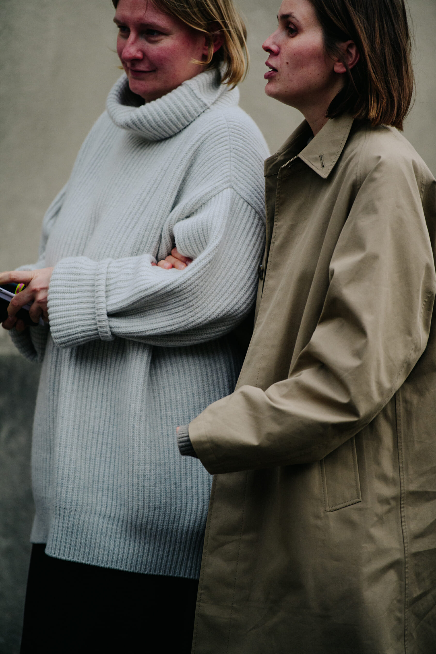 Two women wearing winter tops